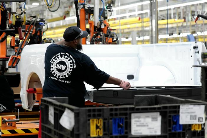 A person works at Ford's Rouge Electric Vehicle Center in Dearborn, Mich. on Sept. 20, 2022. U.S. employers created 199,000 jobns last month, higher than in October, in part as UAW workers returned to work after a strike against the Big Three automakers.
