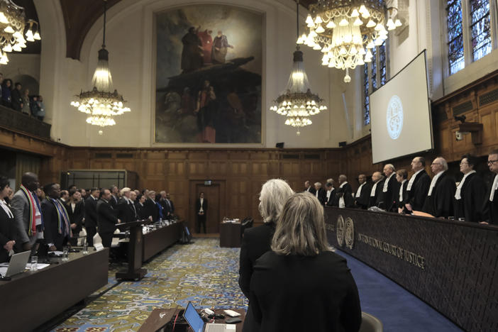 Judges and parties stand up during a hearing at the International Court of Justice in The Hague, Netherlands, Friday. The United Nations' court opened hearings Thursday into South Africa's allegation that Israel's war with Hamas amounts to genocide against Palestinians, a claim that Israel strongly denies.