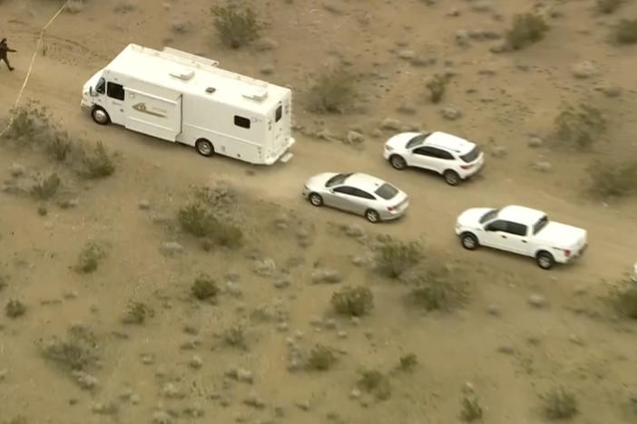 This aerial image from video provided by KTLA shows law enforcement vehicles where several people were found shot to death in El Mirage, Calif., on Wednesday, Jan. 24, 2024.