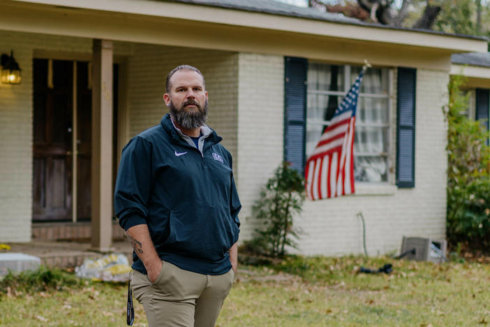 Former Marine Jason Miles stands in front of his home in Clinton, Miss. He lost a sales job during the pandemic and had to take a mortgage forbearance.