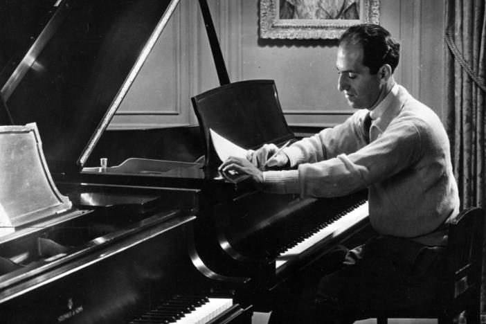 George Gershwin, photographed in his 72nd Street apartment in New York in 1934. His <em>Rhapsody in Blue</em> premiered 100 years ago on Feb. 12, 1924.