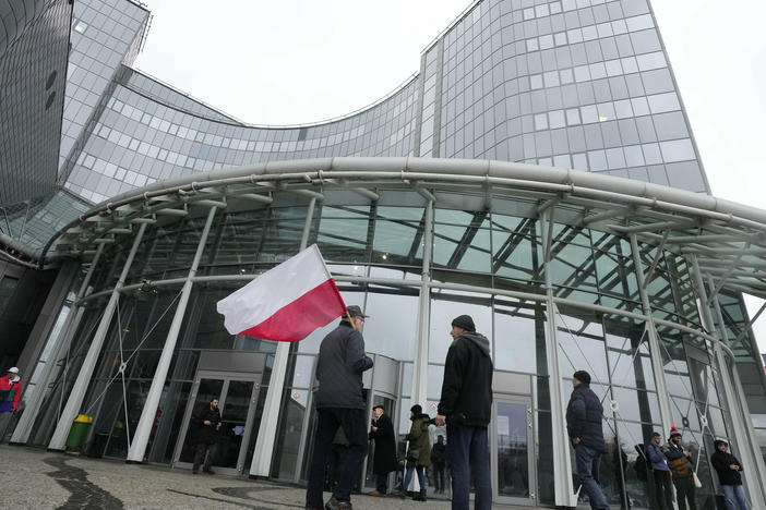 Supporters of the outgoing Law and Justice party protest outside the headquarters of Poland's state-owned TVP broadcaster after the new government took control last December.