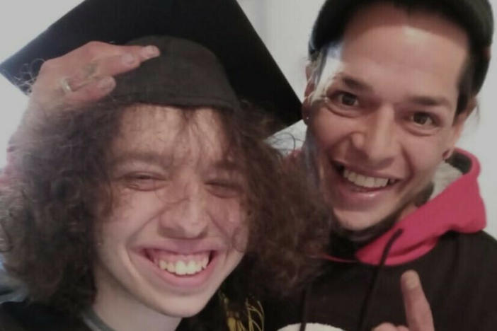 Guillermo A. Santos on his high school graduation day in 2021, with his father, Guillermo Jose Santos. The elder Santos died later the same year of a drug overdose.