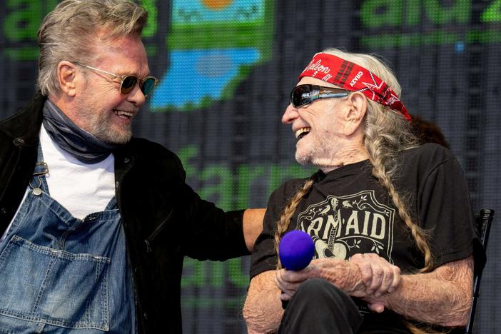 John Mellencamp and Willie Nelson, seen here at Farm Aid last year, will headline the 2024 Outlaw Music Festival tour.