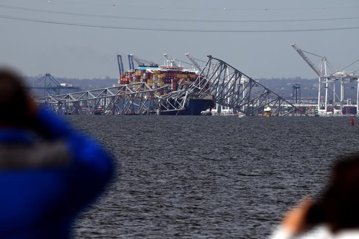 Francis Scott Key Bridge collapsed after being hit by the Dali container vessel, as seen from Riviera Beach, Md., on Tuesday.