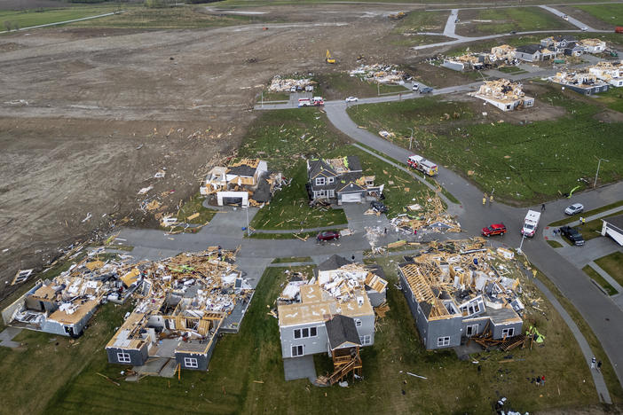 Damaged houses are seen after a tornado passed through the area near Omaha, Neb., on Friday, April 26, 2024.