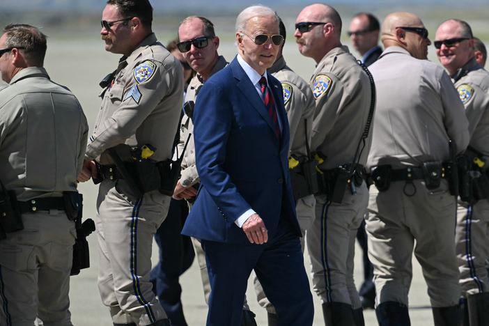 President Biden makes his way to Air Force One after posing with highway patrol troopers in Mountain View, Calif., on May 10.