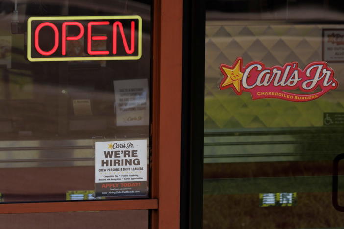 A help wanted sign is shown at a fast food restaurant in Solana Beach, California, Nov., 9, 2021. Photo by Mike Blake/Reuters