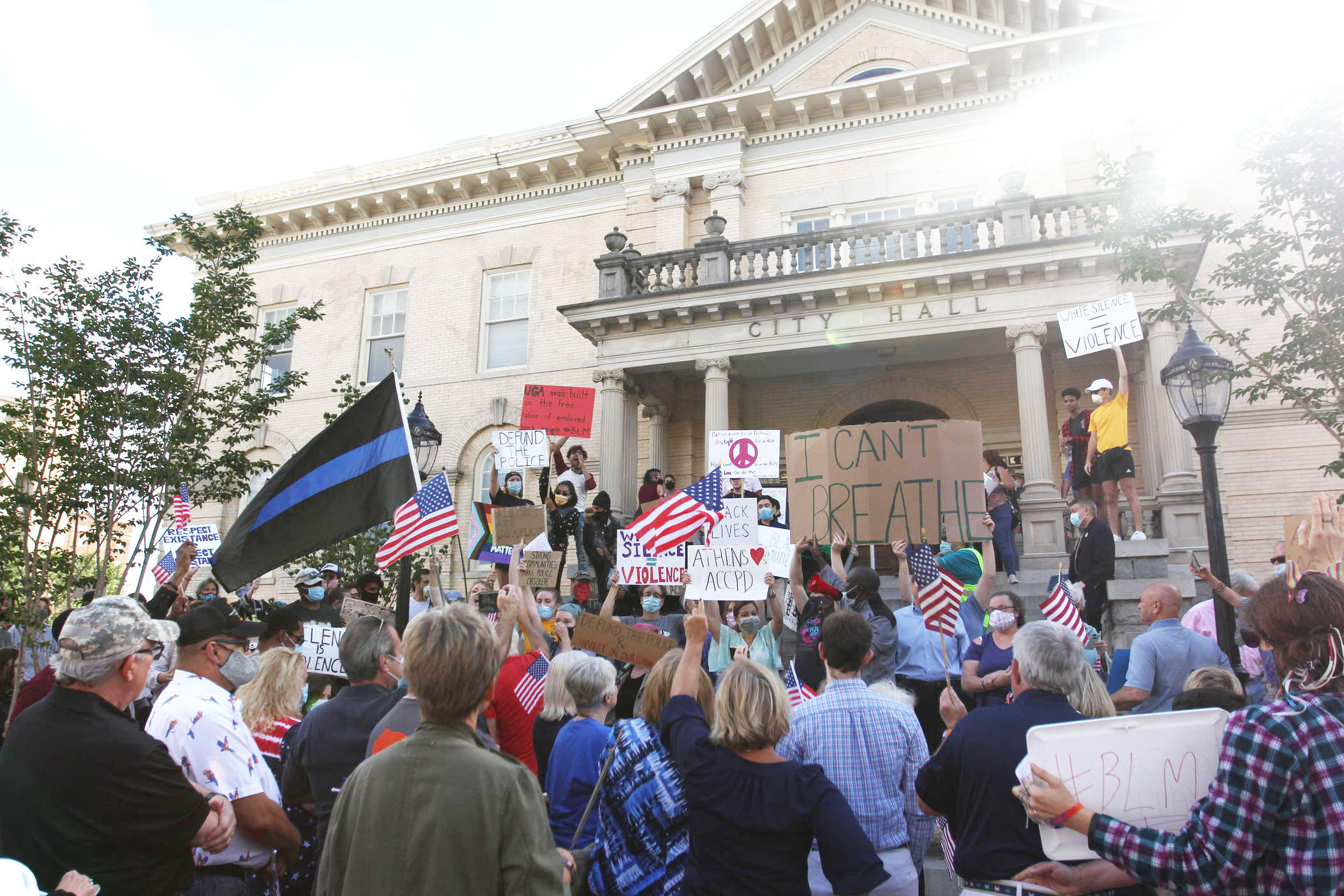 Protesters at Athens-Clarke County City Hall clash during a public input meeting for the 2021 local government budget on June 16, 2020 in Athens, Georgia. A budget amendment proposing a reallocation of funds within the Athens-Clarke County Police Department brought hundreds of citizens out both in opposition and support of the proposal. 