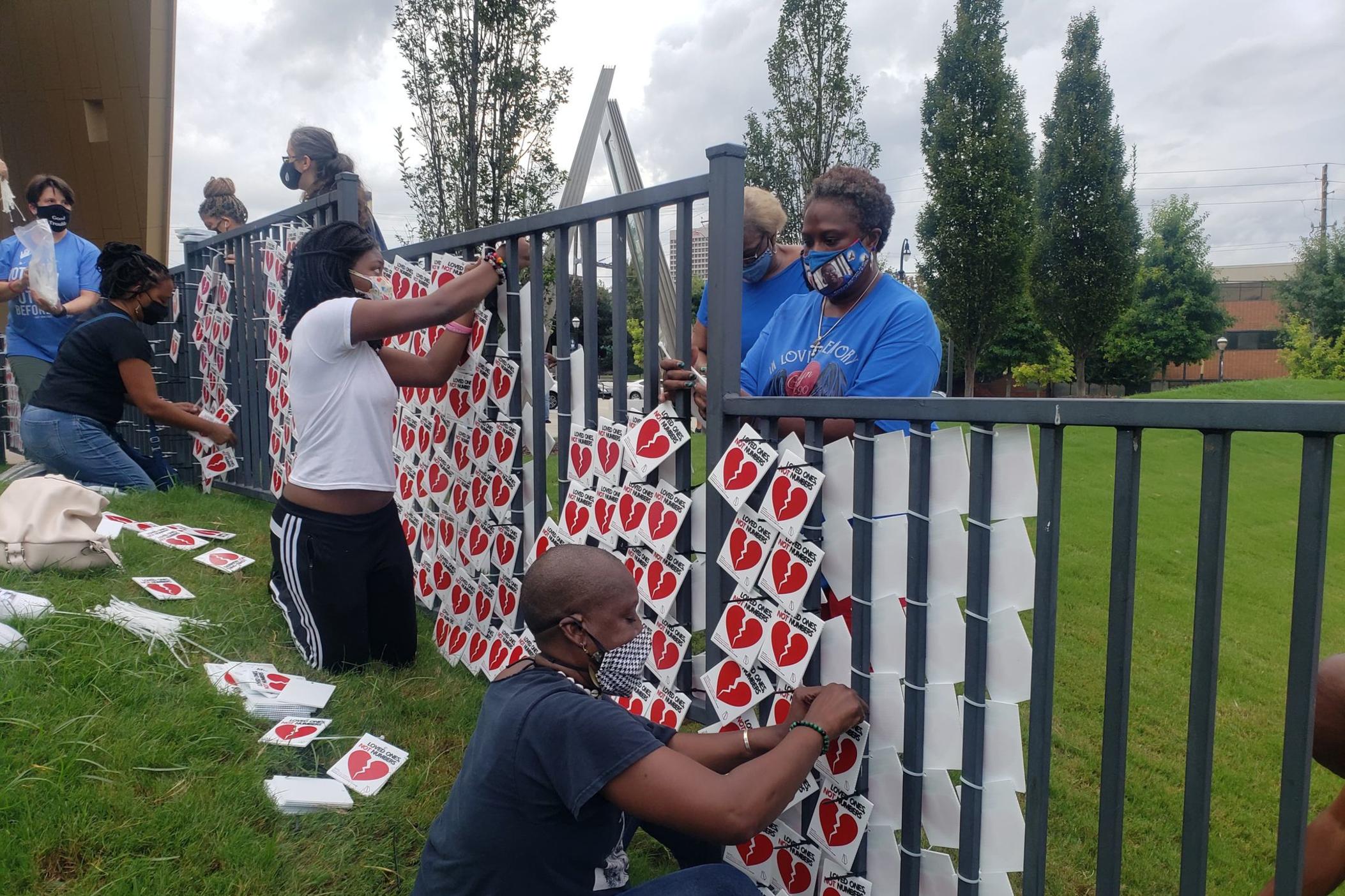 Community members gathered at the National Center for Civil and Human Rights to honor the more than 5,000 victims of COVID-19 in the state.