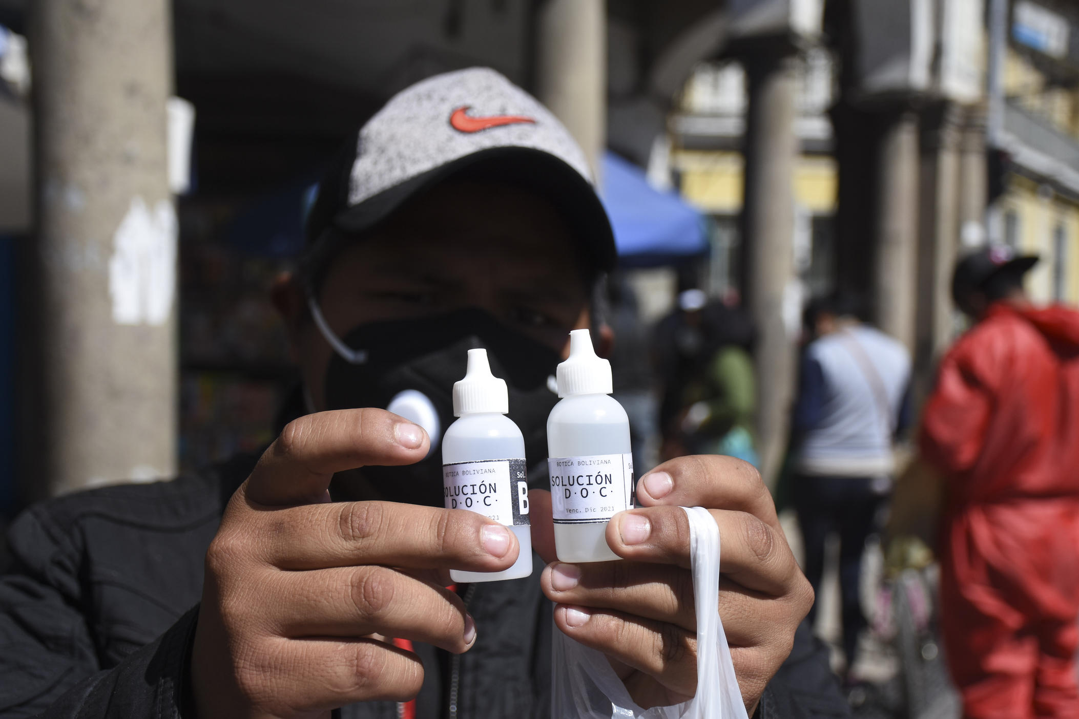 A man holds bottles of a fake coronavirus cure