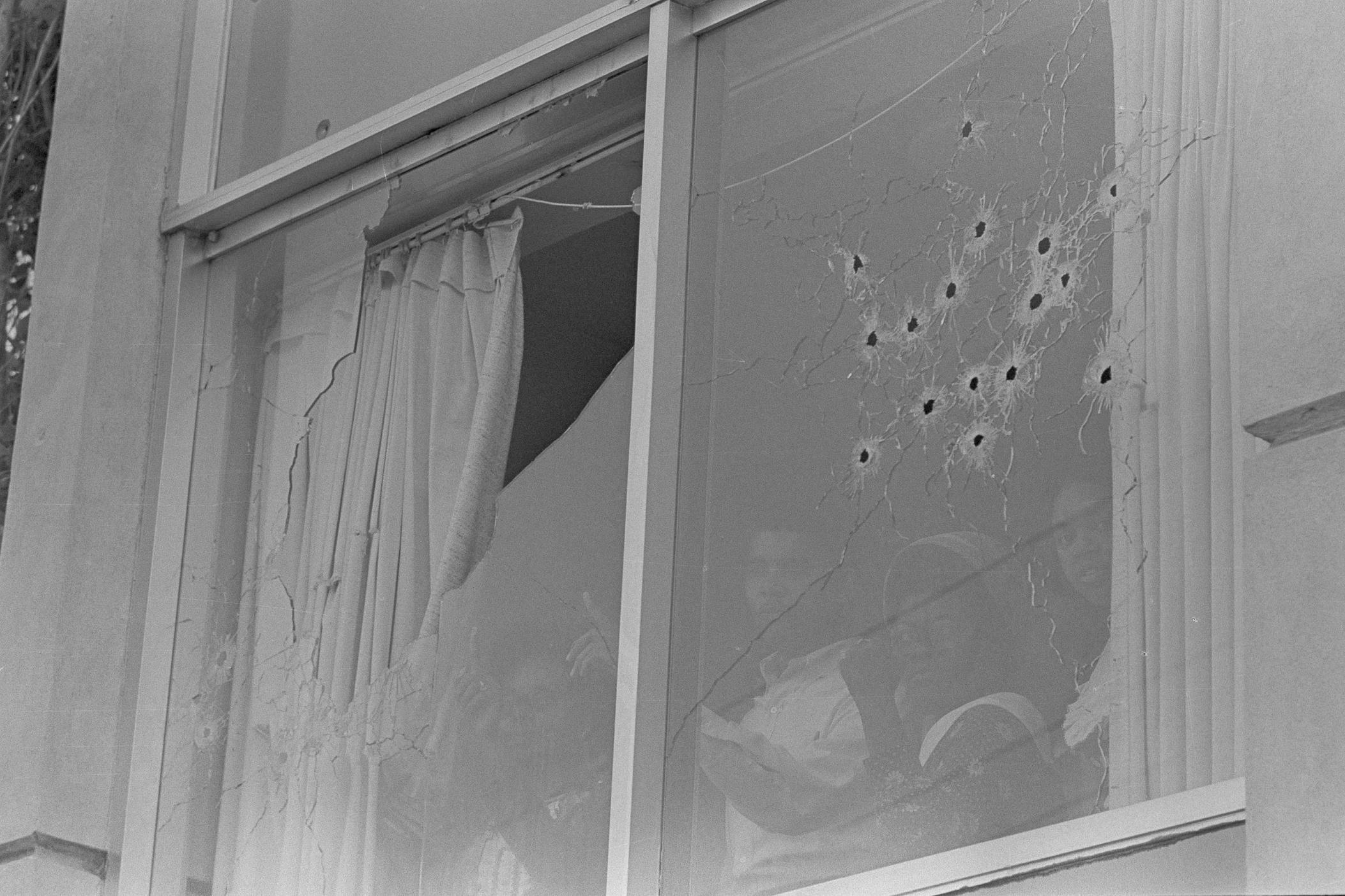 Students peer out of the bullet-riddled windows of Alexander Hall, a women's dormitory at Jackson State College in Jackson, Miss., after two African-American students were killed and 12 injured when police opened fire on the building, claiming they were fired upon by snipers, May 15, 1970. The shooting occurred after rioting broke out on the campus.