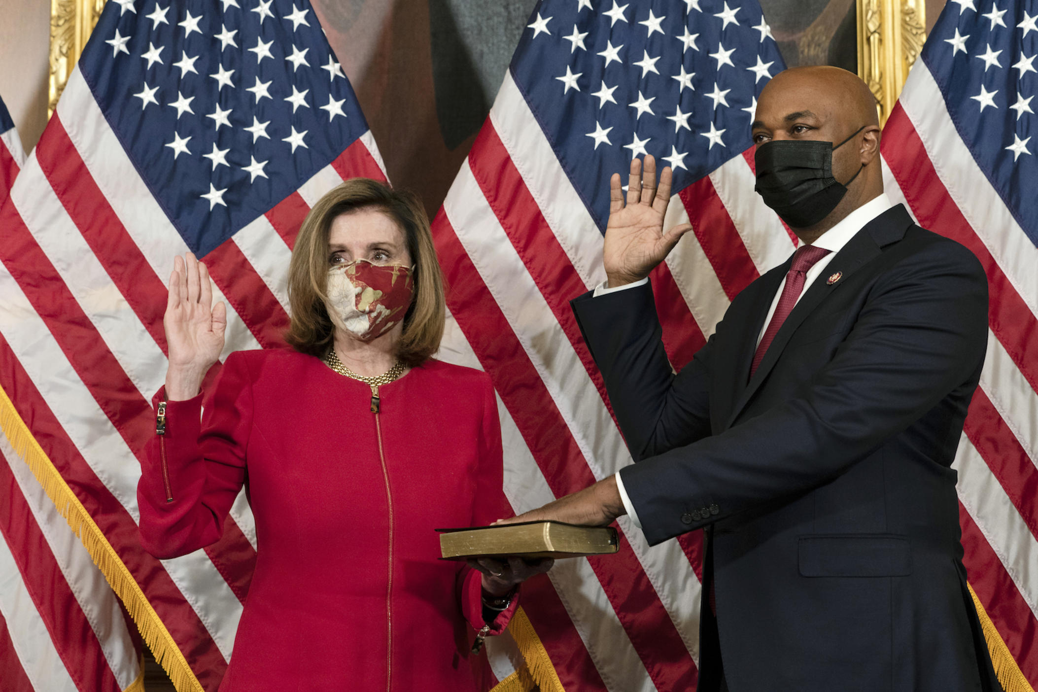 House Speaker Nancy Pelosi, of Calif., holds a ceremonial swearing-in of Rep. Kwanza Hall, D-Ga., on Capitol Hill, Thursday, Dec. 3, 2020, in Washington. Hall will serve the remaining term of the late Rep. John Lewis. (AP Photo/Jacquelyn Martin)