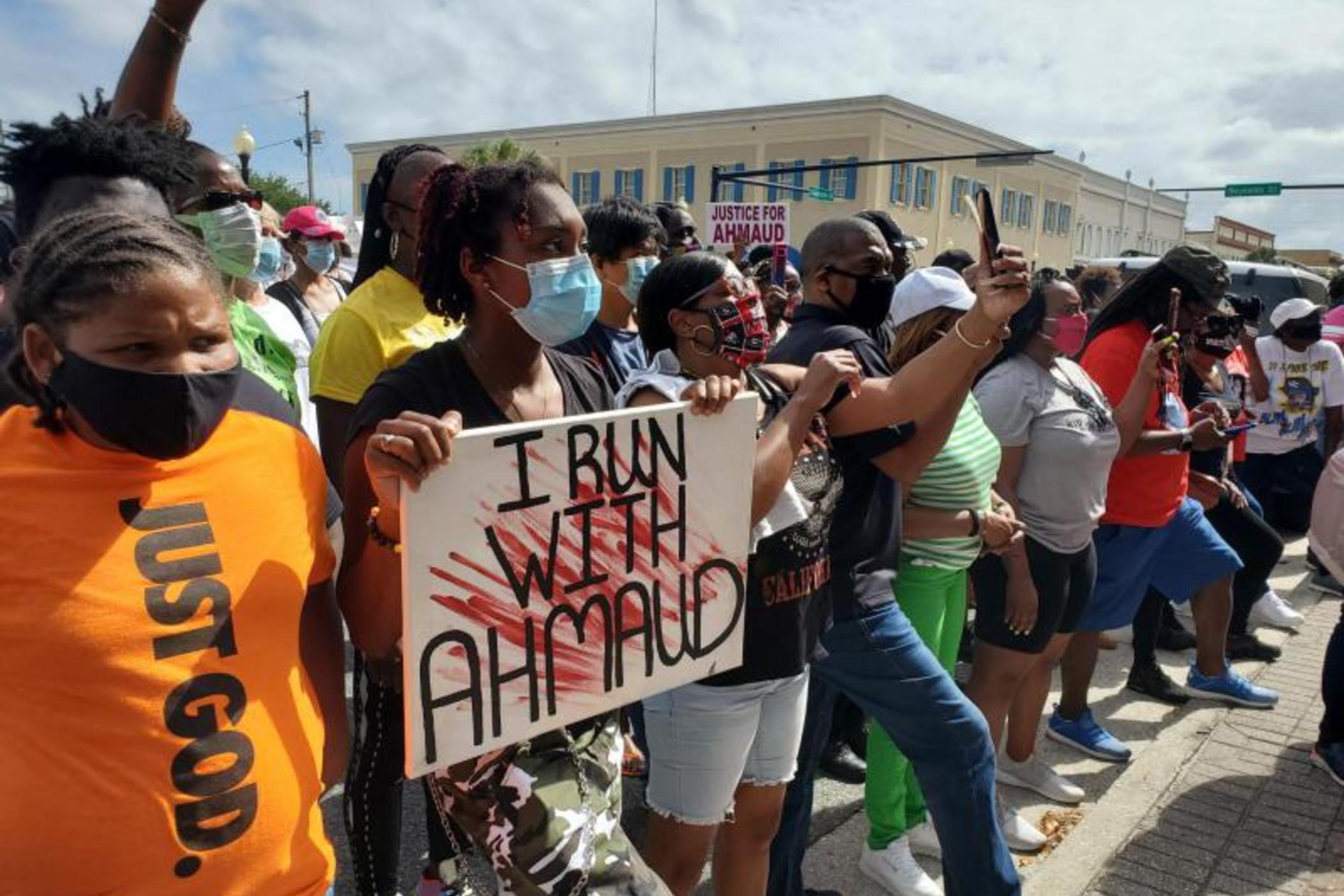 Protesters gather in front of the Brunswick City Hall during a march for Ahmaud Arbery.