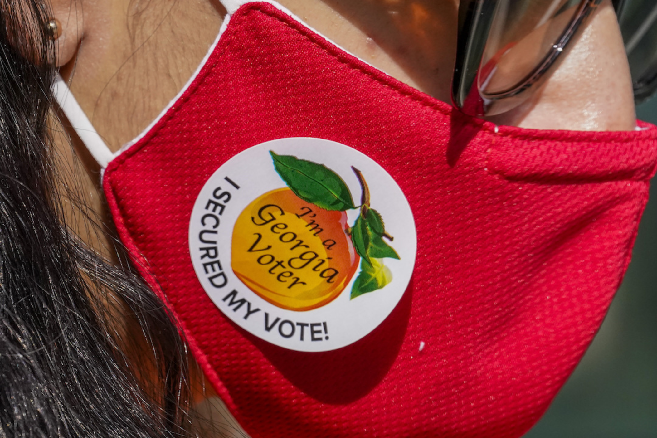 A person wears an “I’m a Georgia Voter” sticker after voting on Election Day in Atlanta on Tuesday, Nov. 3, 2020