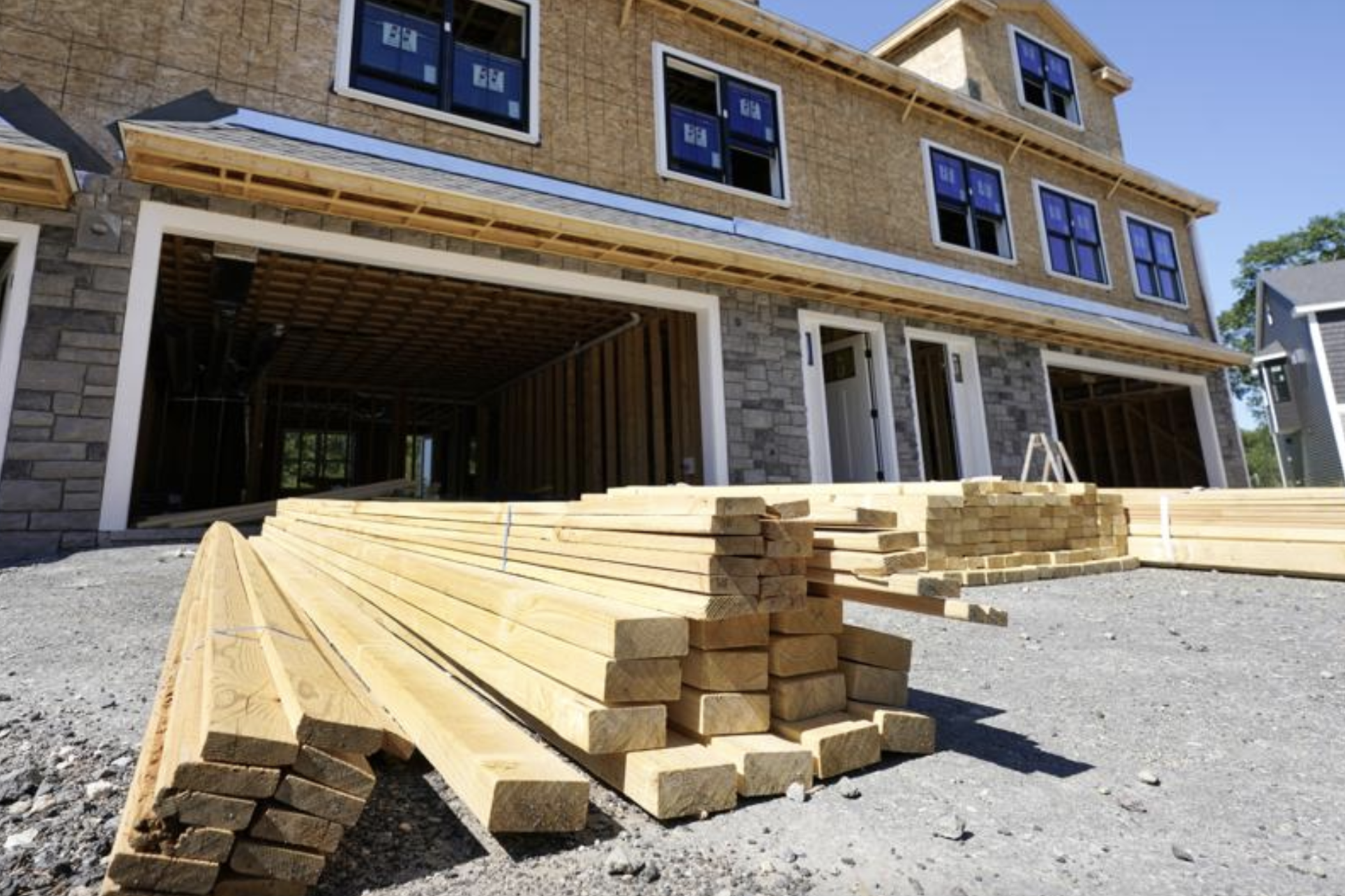 Lumber is piled at a housing construction site, Thursday, June 24, 2021, in Middleton, Mass. Home construction in the U.S. rose a strong 6.3% in June, another big swing in what has been an up-and-down year so far. The rise in June put home construction at a seasonally adjusted annual rate of 1.64 million units, the Commerce Department reported Tuesday, July 20. 