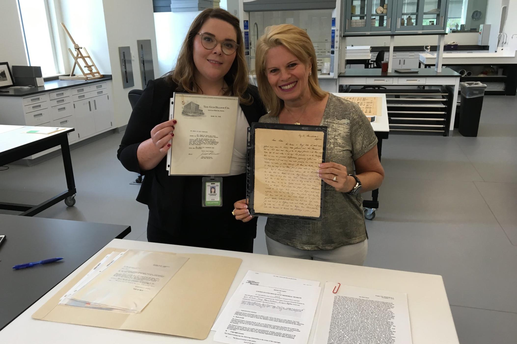 Atlanta resident Alli Allen (right) holding her collection donation, alongside U.S. Holocaust Memorial Museum Curator Kassandra LaPrade-Seuthe. Courtesy: US Holocaust Memorial Museum.