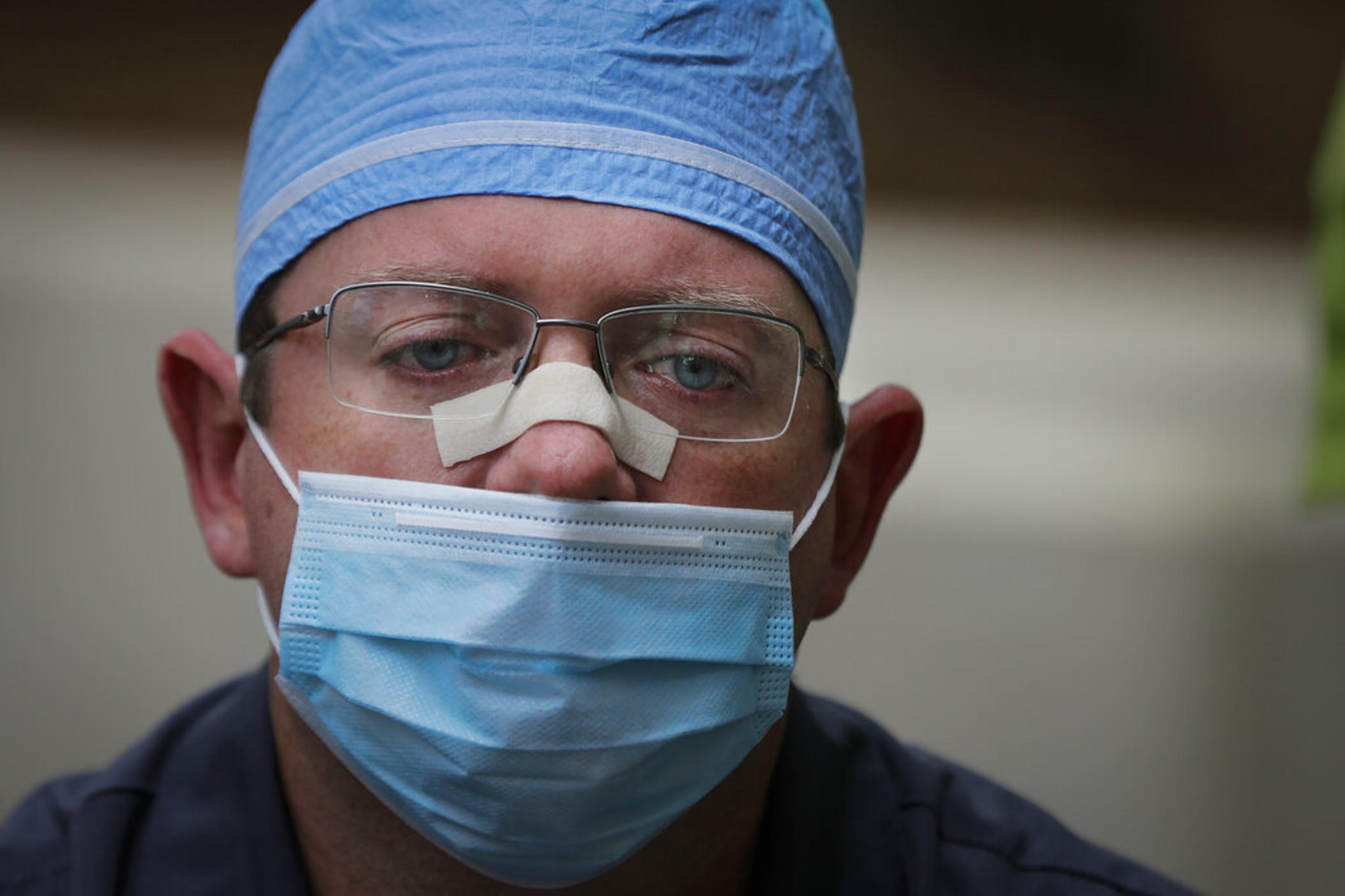 Chaplain Will Runyon holds back tears as he speaks of the hardships and death amid the COVID-19 coronavirus outbreak outside of Phoebe Putney Memorial Hospital in Albany, Ga., on Monday, April 20, 2020. 