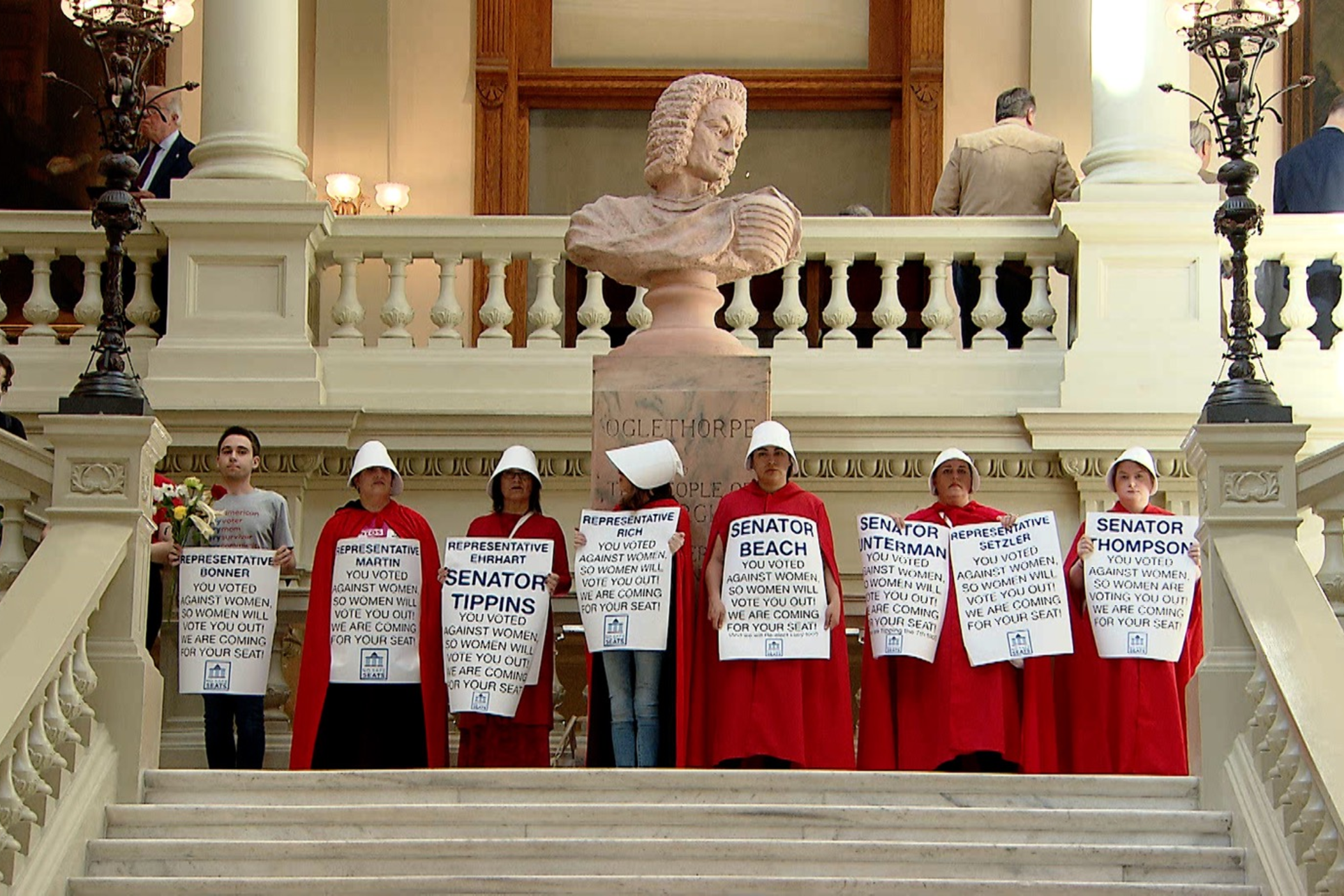 In costumes reminiscent of the TV show "The Handmaid's Tale," a group protests Georgia’s restrictive anti-abortion bill, HB 481, at the Georgia Capitol in April 2019. 