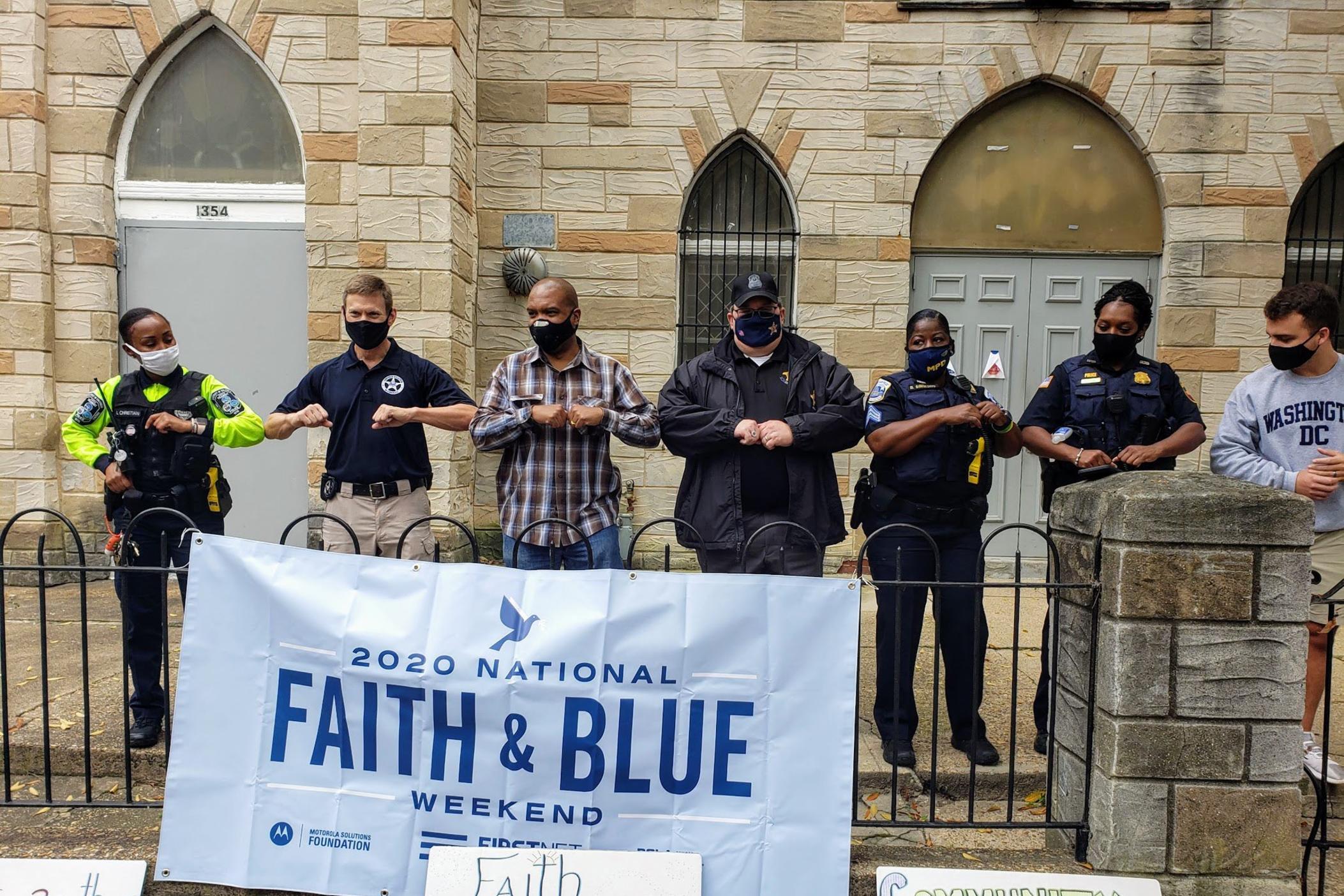 Law enforcement and community members touch elbows at a 2020 National Faith & Blue Weekend event in Washington, D.C.