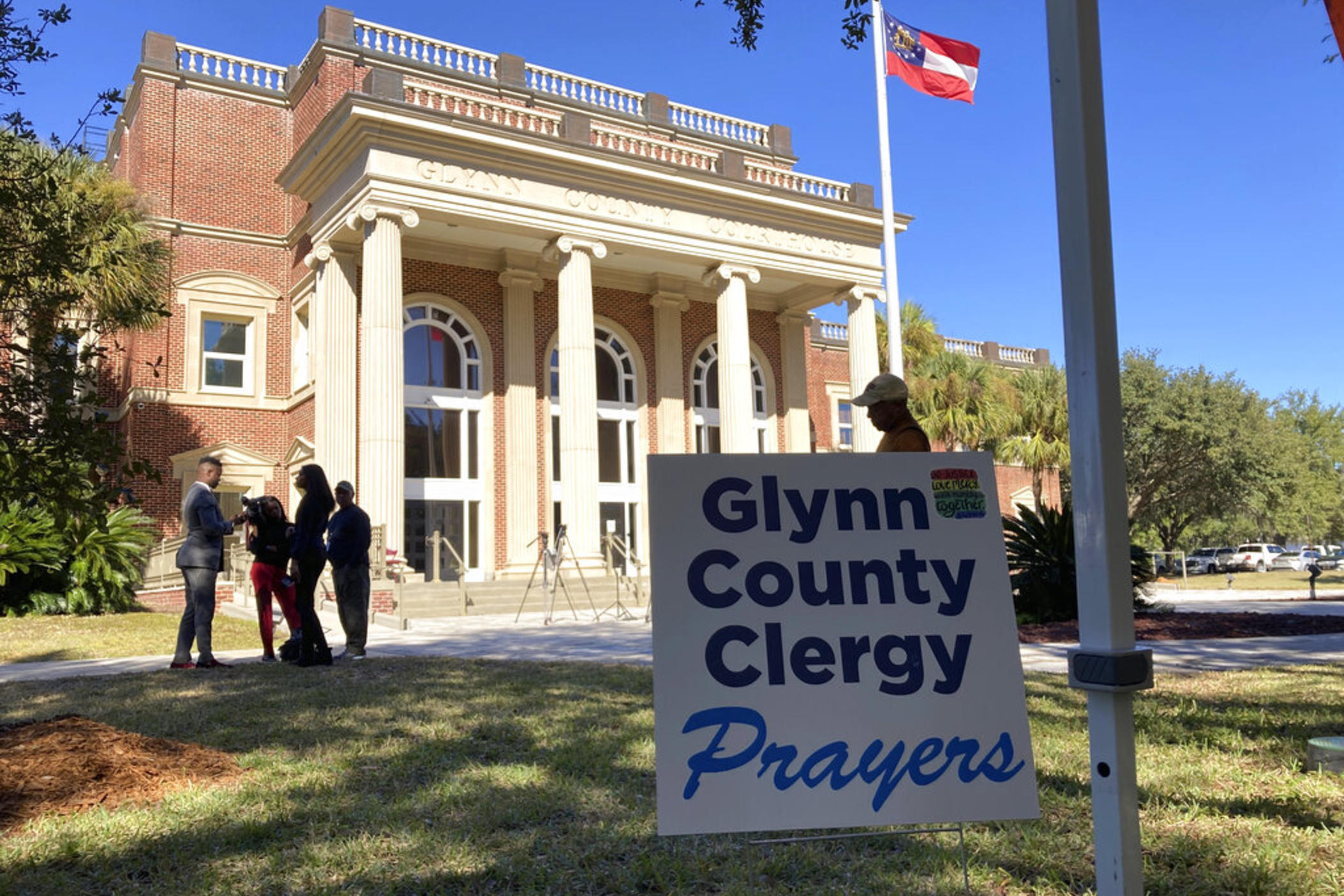 Black and white pastors have set up a tent and are asking for prayers during the trial over the death of Ahmaud Arbery at the Glynn County courthouse in Brunswick, Georgia, on Tuesday, Nov. 16, 2021. A call by a defense attorney to kick Black pastors out of the courtroom angered the community.