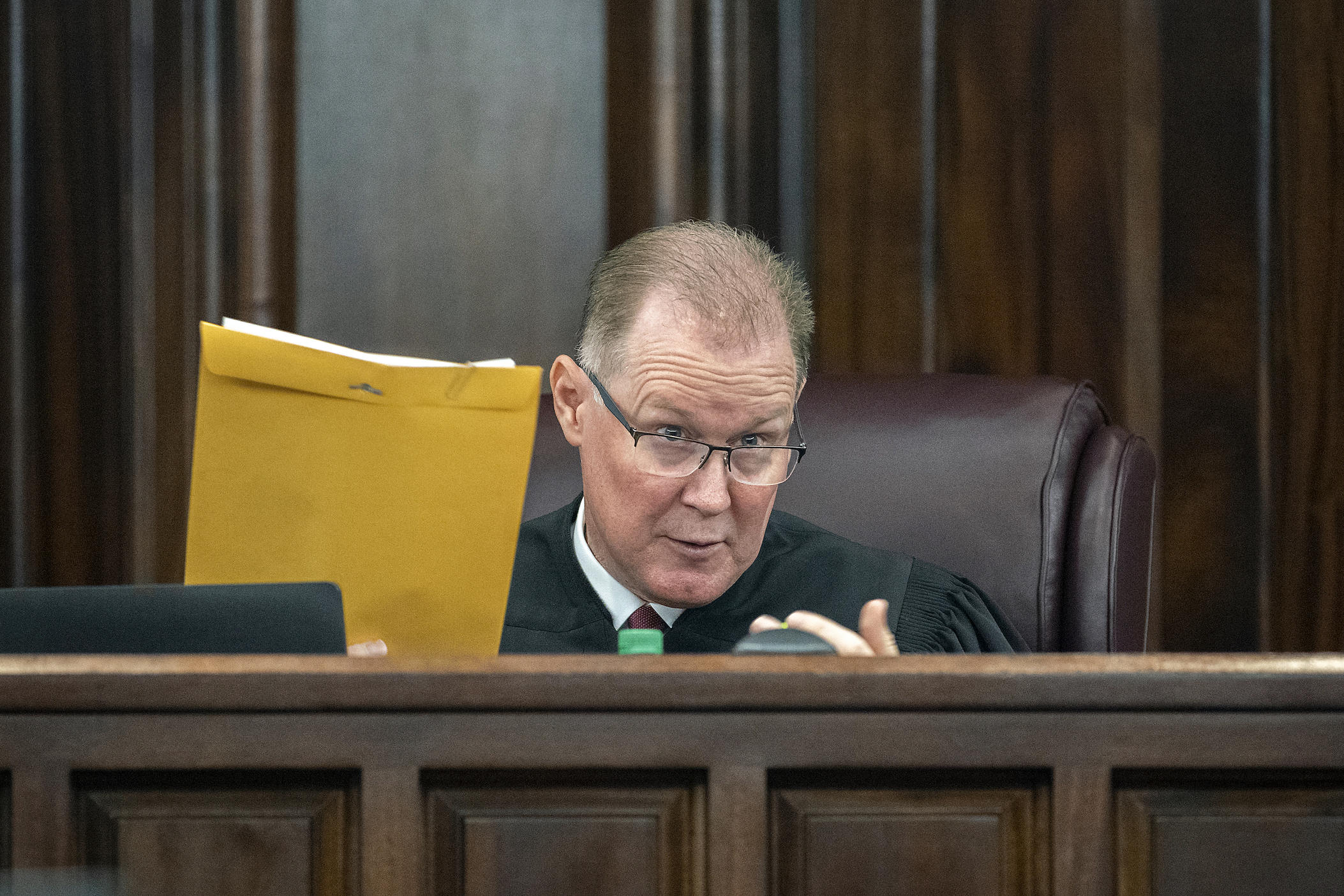 Superior Court Judge Timothy Walmsley speaks with attorneys before the start of closing arguments during the trial of Greg McMichael, his son Travis McMichael, and William "Roddie" Bryan, at the Glynn County Courthouse, Monday, Nov. 22, 2021, in Brunswick, Ga.