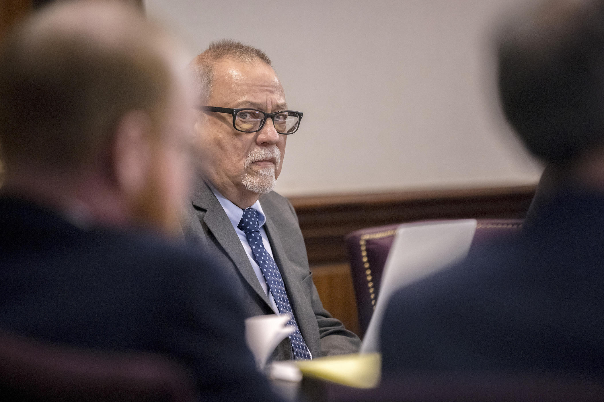 Greg McMichael, center, listens to arguments during the trial of himself, his son Travis McMichael, and a neighbor, William "Roddie" Bryan in the Glynn County Courthouse, Tuesday, Nov. 9, 2021, in Brunswick, Ga.