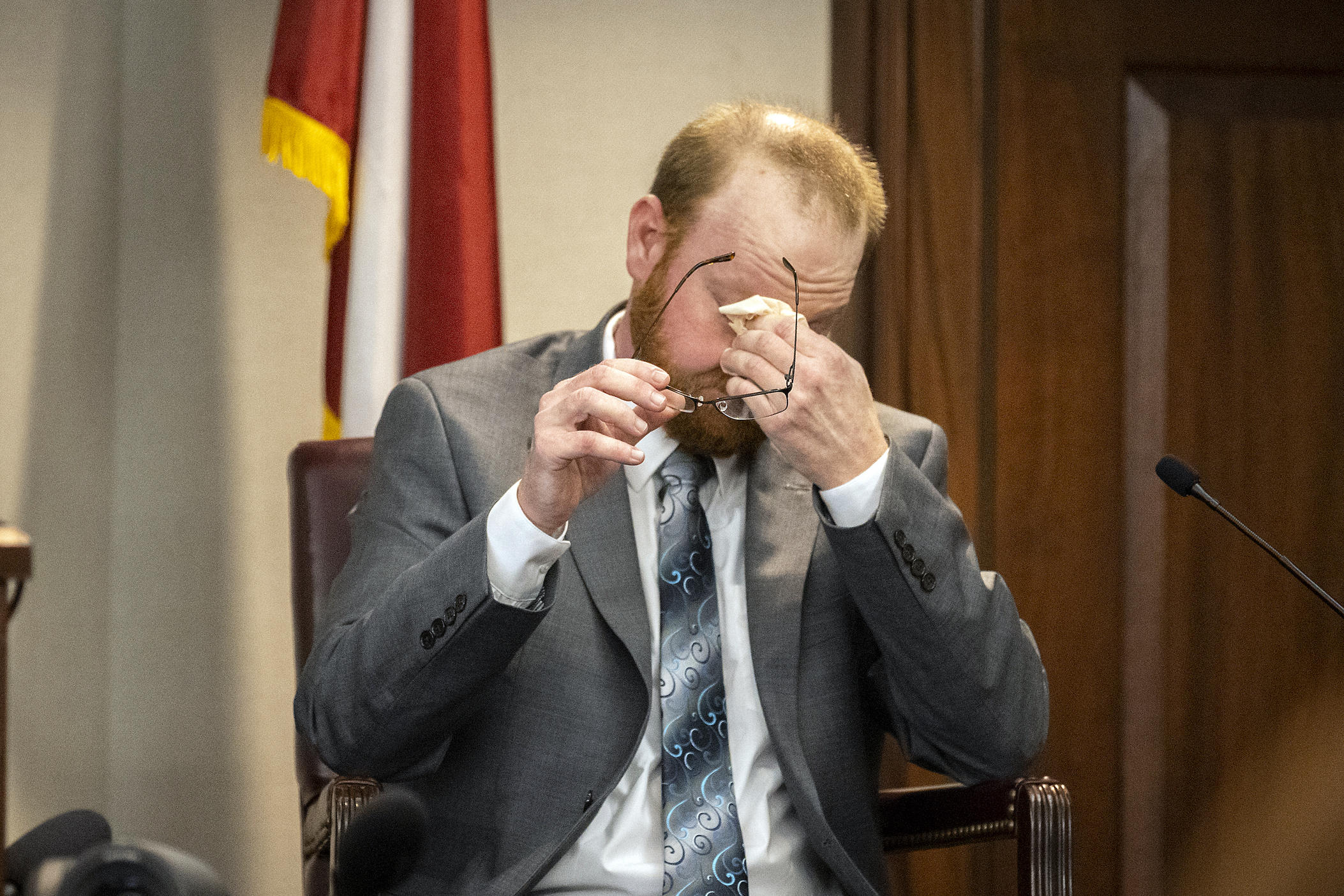 Travis McMichael reacts to question during his testimony in the trial of he and his father Greg McMichael and neighbor William "Roddie" Bryan in the Glynn County Courthouse, Wednesday, Nov. 17, 2021, in Brunswick, Ga.