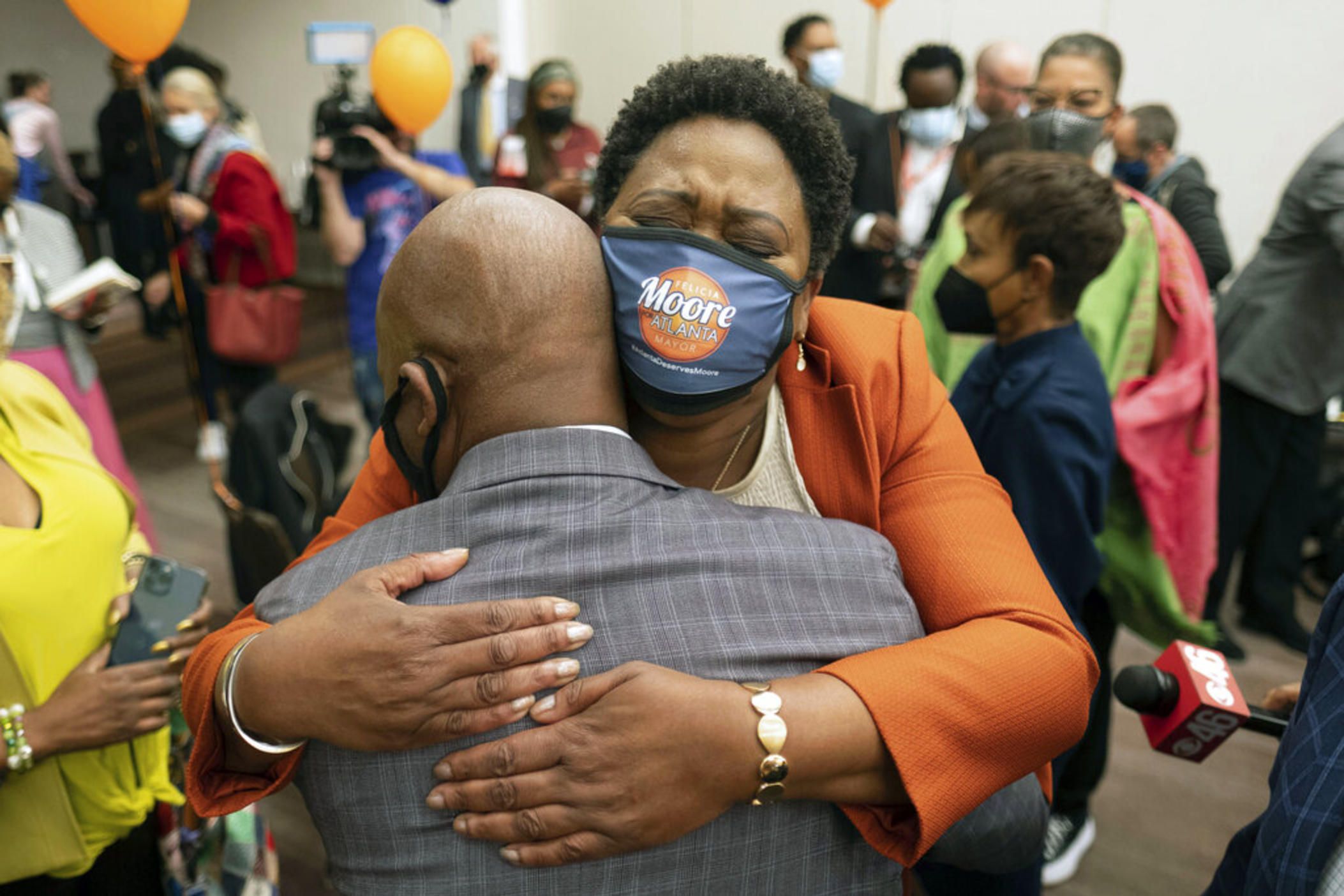 Felicia Moore, Atlanta City Council president and mayoral candidate, becomes emotional while hugging a longtime supporter at her election night party Tuesday, Nov. 2, 2021 in Atlanta.