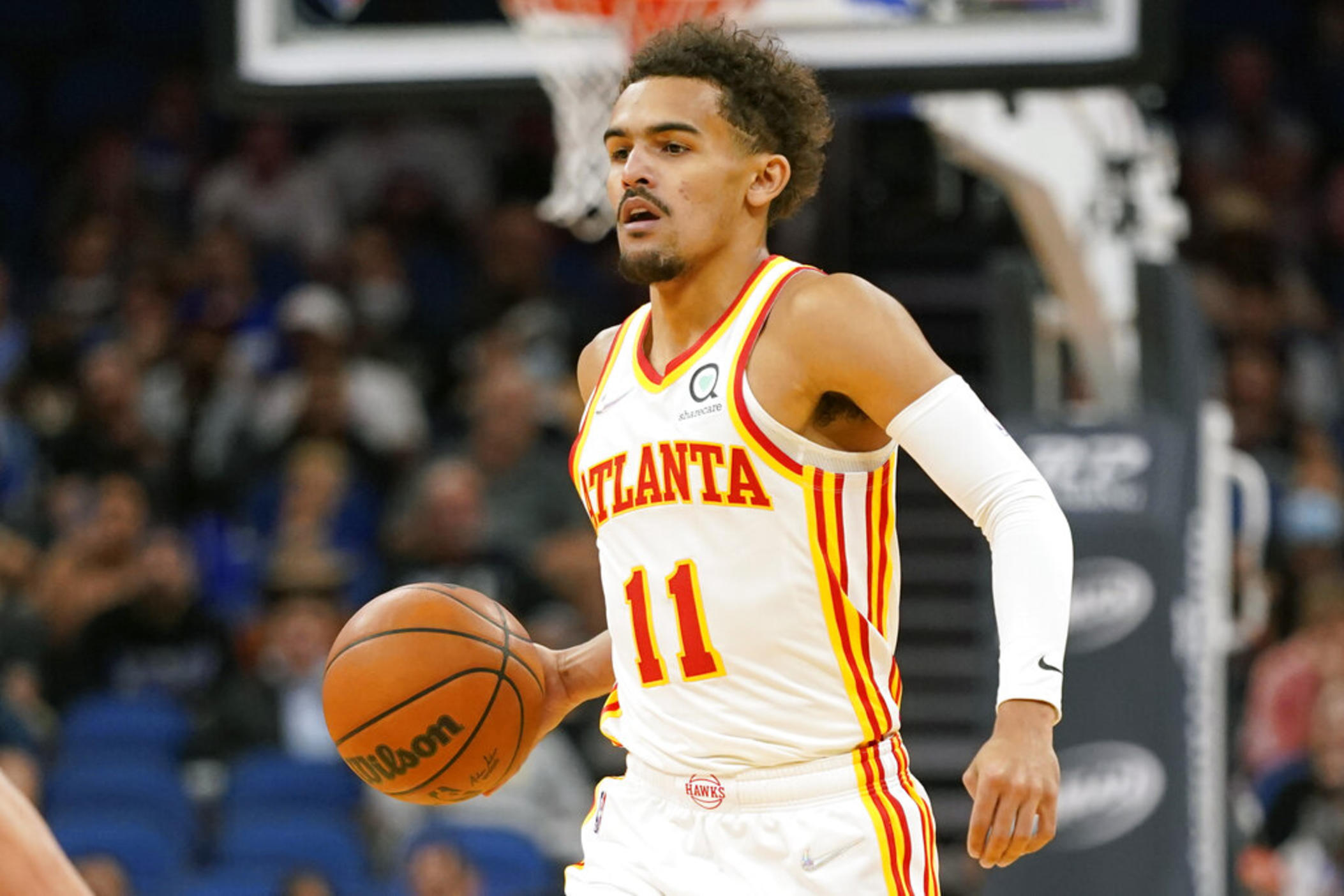 Atlanta Hawks guard Trae Young (11) moves the ball against the Orlando Magic during the first half of an NBA basketball game, Wednesday, Dec. 15, 2021, in Orlando, Fla. (AP Photo/John Raoux)