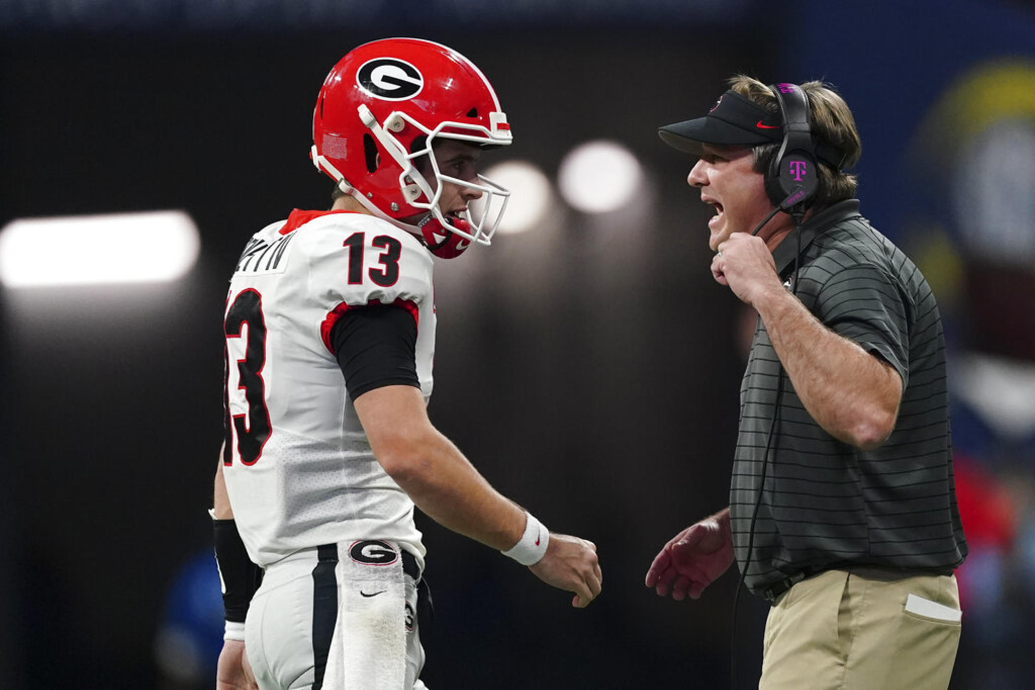 Georgia head coach Kirby Smart speaks on the field during the first half of the Southeastern Conference championship NCAA college football game against Alabama, Saturday, Dec. 4, 2021, in Atlanta.