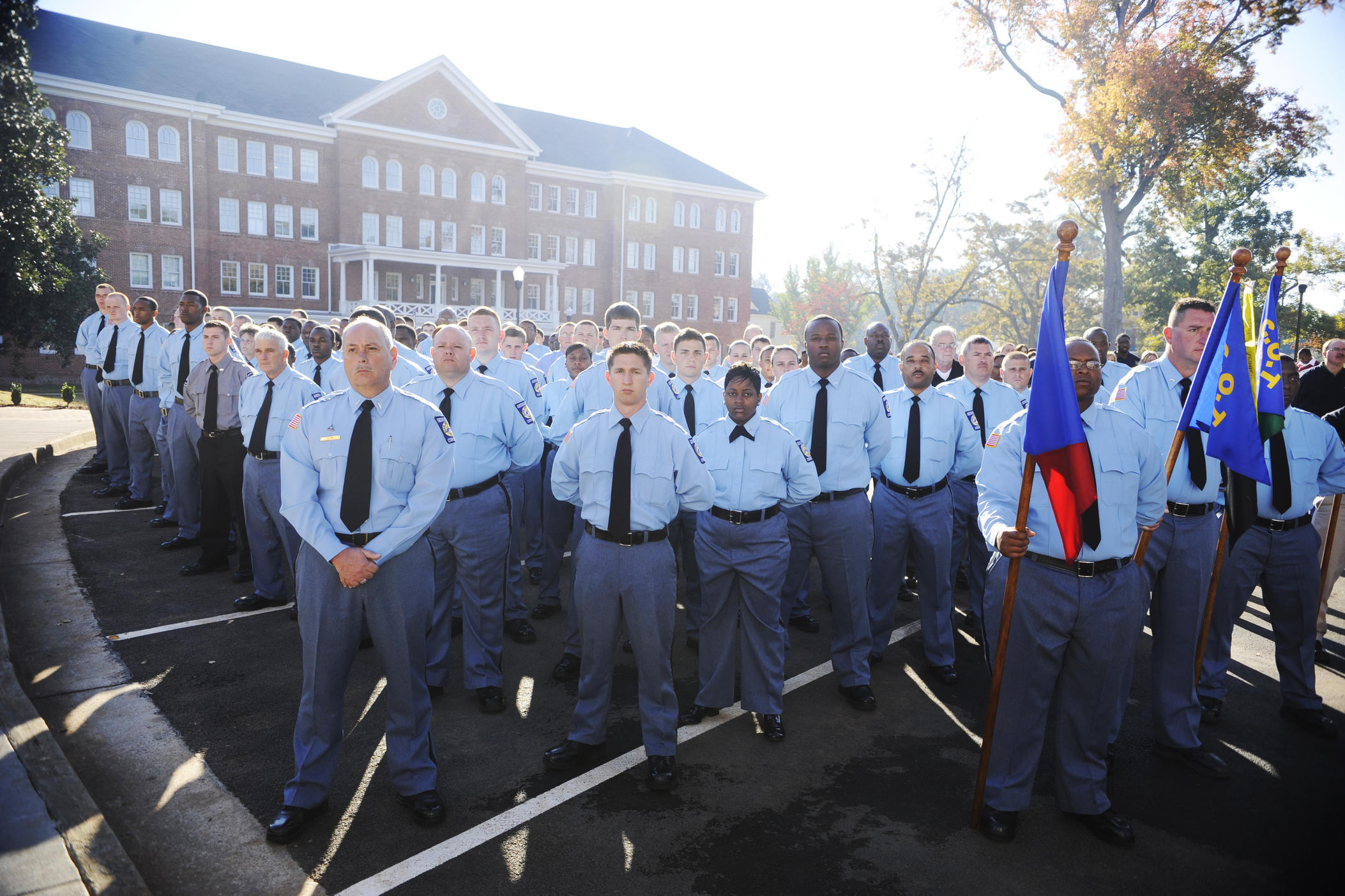 Georgia Department of Corrections cadets and trainers before the 2010 ribbon cutting for the department's training facility and offices in Forsyth. A labor strike of the incarcerated would come about month later. GDC lost over 2,000 correctional officers in the following year. 