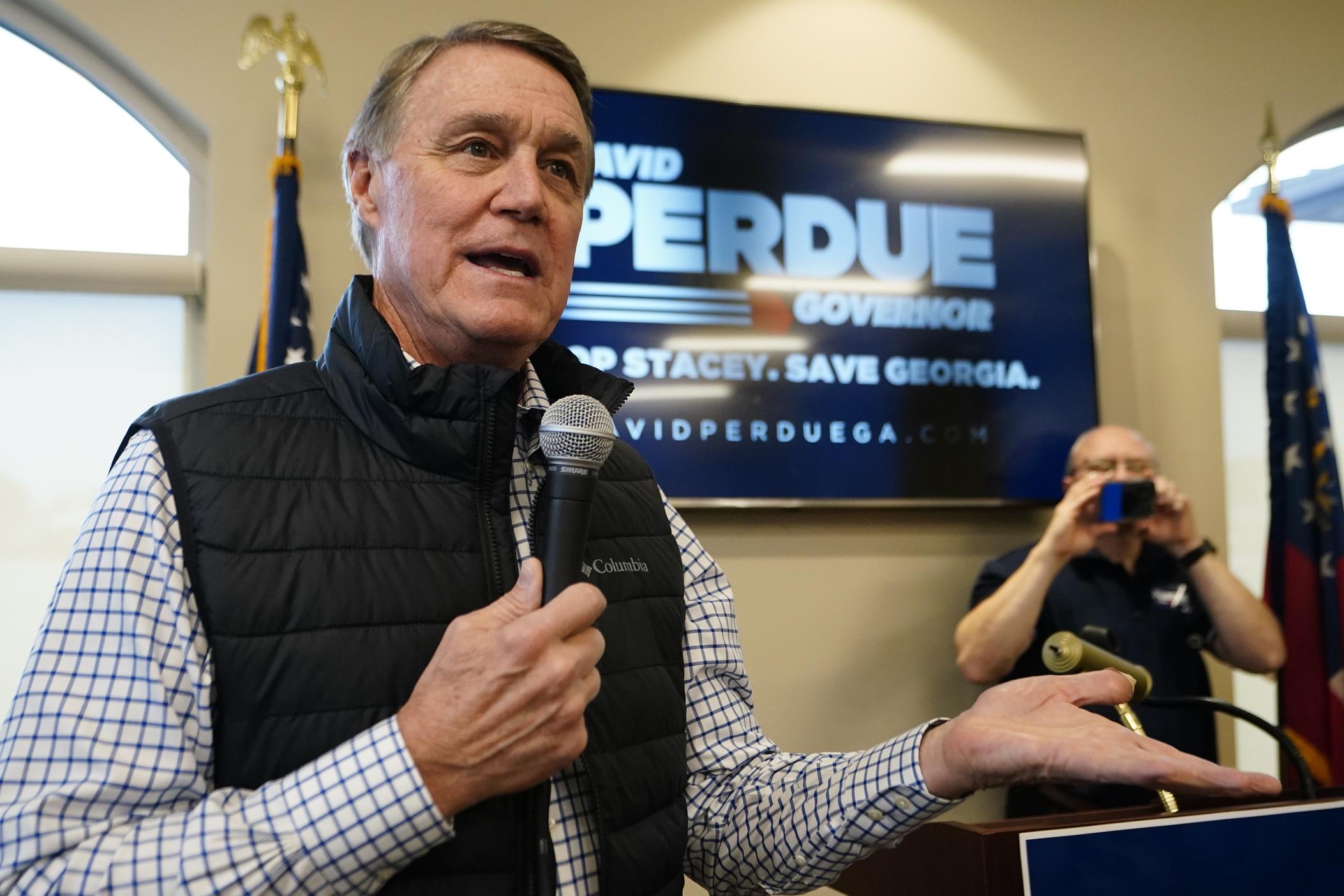  Former Sen. David Perdue, a Republican candidate for governor of Georgia, arrives to speaks at a campaign stop at the Covington airport Wednesday, Feb. 2, 2022, in Covington, Ga.