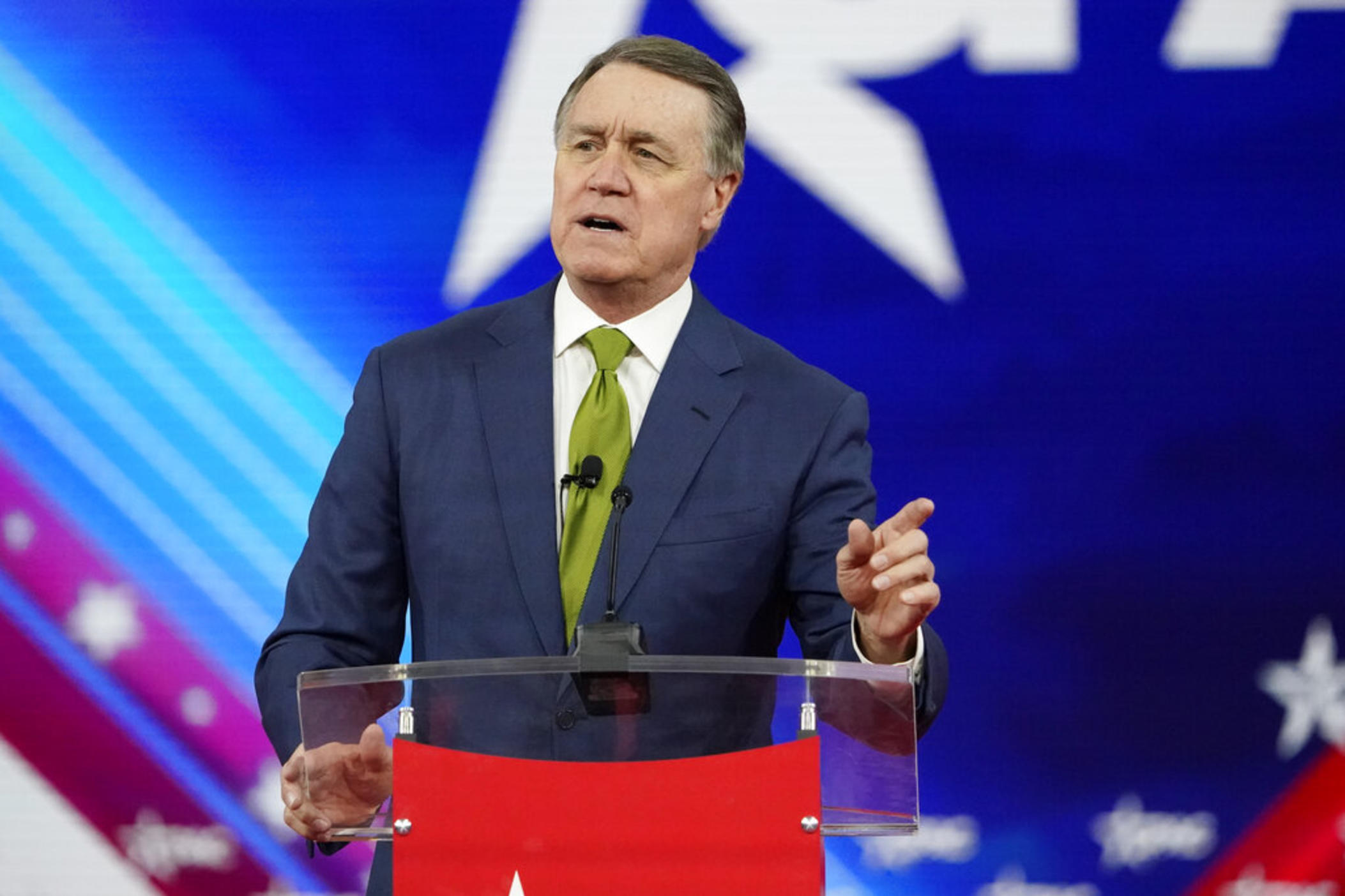 Former Sen. David Perdue R-Ga., speaks at the Conservative Political Action Conference (CPAC) Sunday, Feb. 27, 2022, in Orlando, Fla. A planned $5 billion electric vehicle plant that has been billed as the largest economic development project in Georgia’s history is drawing opposition from an unusual source: former Republican U.S. senator Perdue. A former corporate executive, Perdue is looking to unseat Georgia Gov. Brian Kemp, a fellow Republican, in this year’s gubernatorial race.