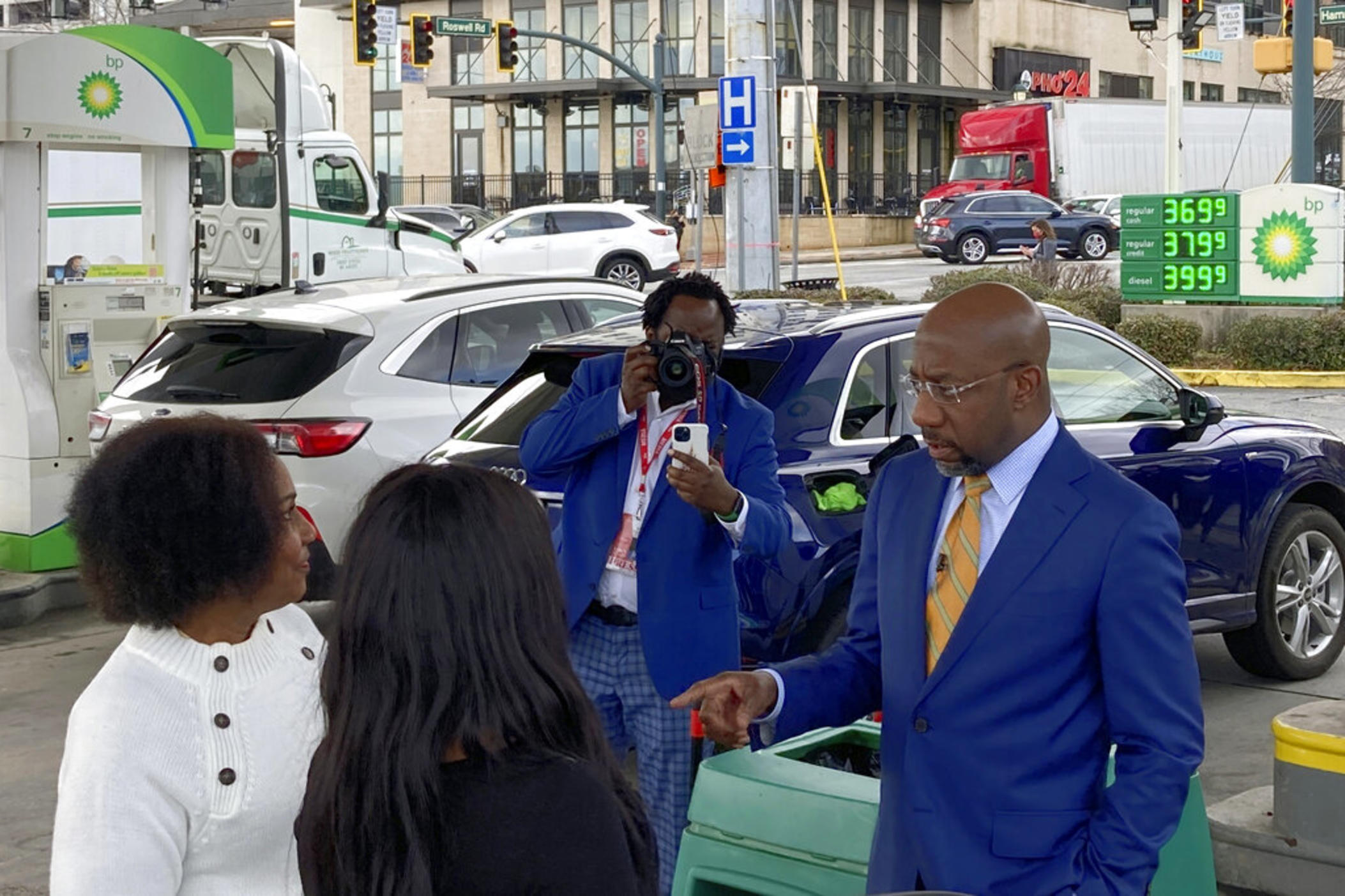 U.S. Sen. Raphael Warnock, D-Ga., speaks to supporters at a gas station Feb. 22, 2022, in Sandy Springs, Ga. Warnock on Tuesday, March 8, 2022, renewed his call to suspend the federal gas tax as Republican Gov. Brian Kemp of Georgia called for suspending the state gas tax.