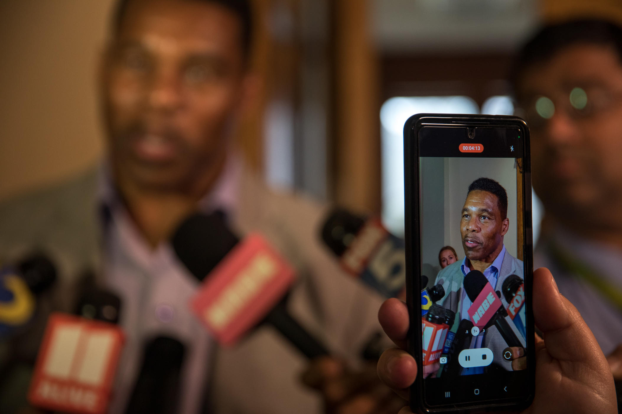 Republican U.S. Senate candidate Herschel Walker takes questions at a rare appearance in front of reporters.