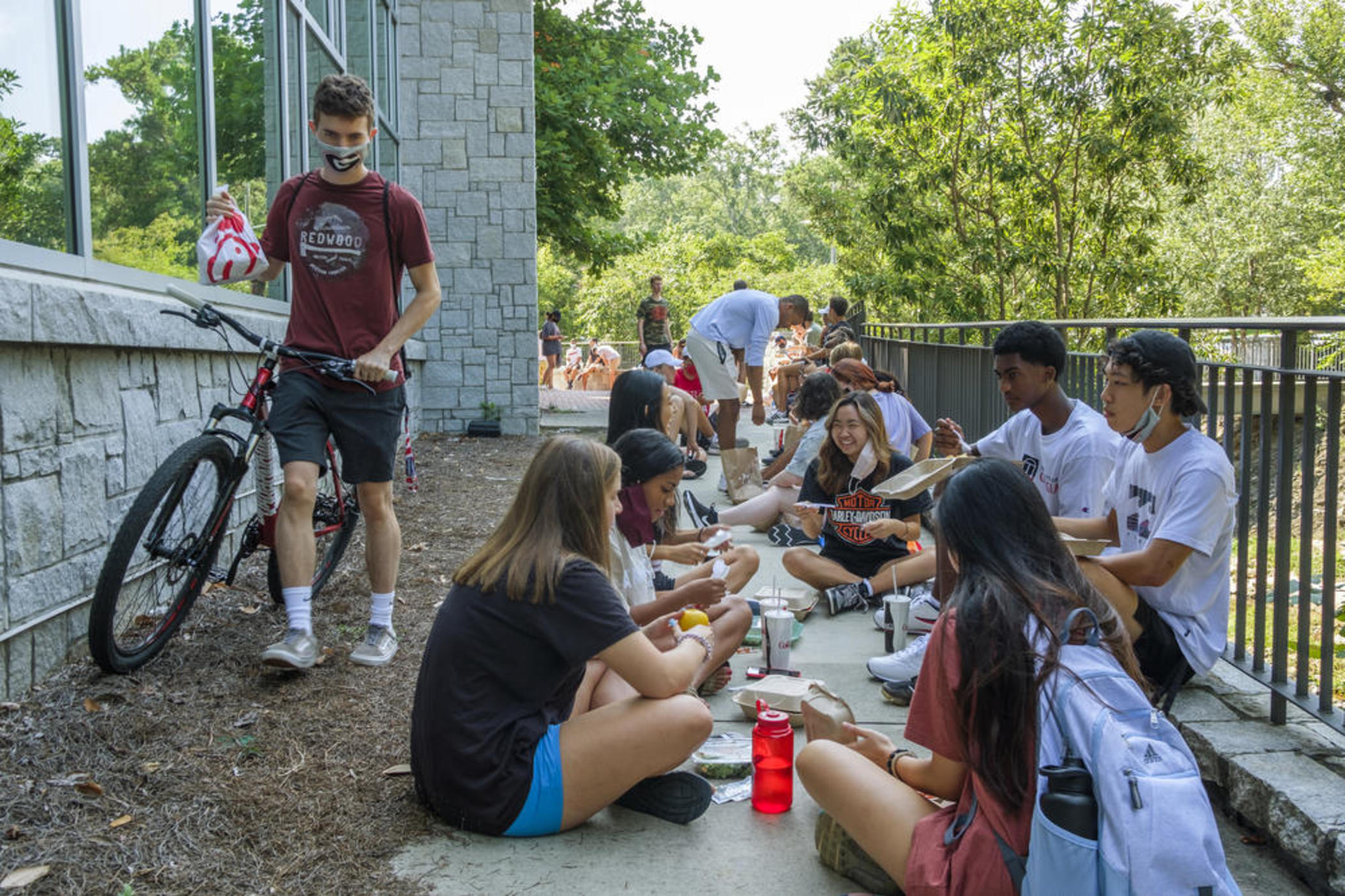 University of Georgia freshmen eat lunch behind one of the main dining halls.