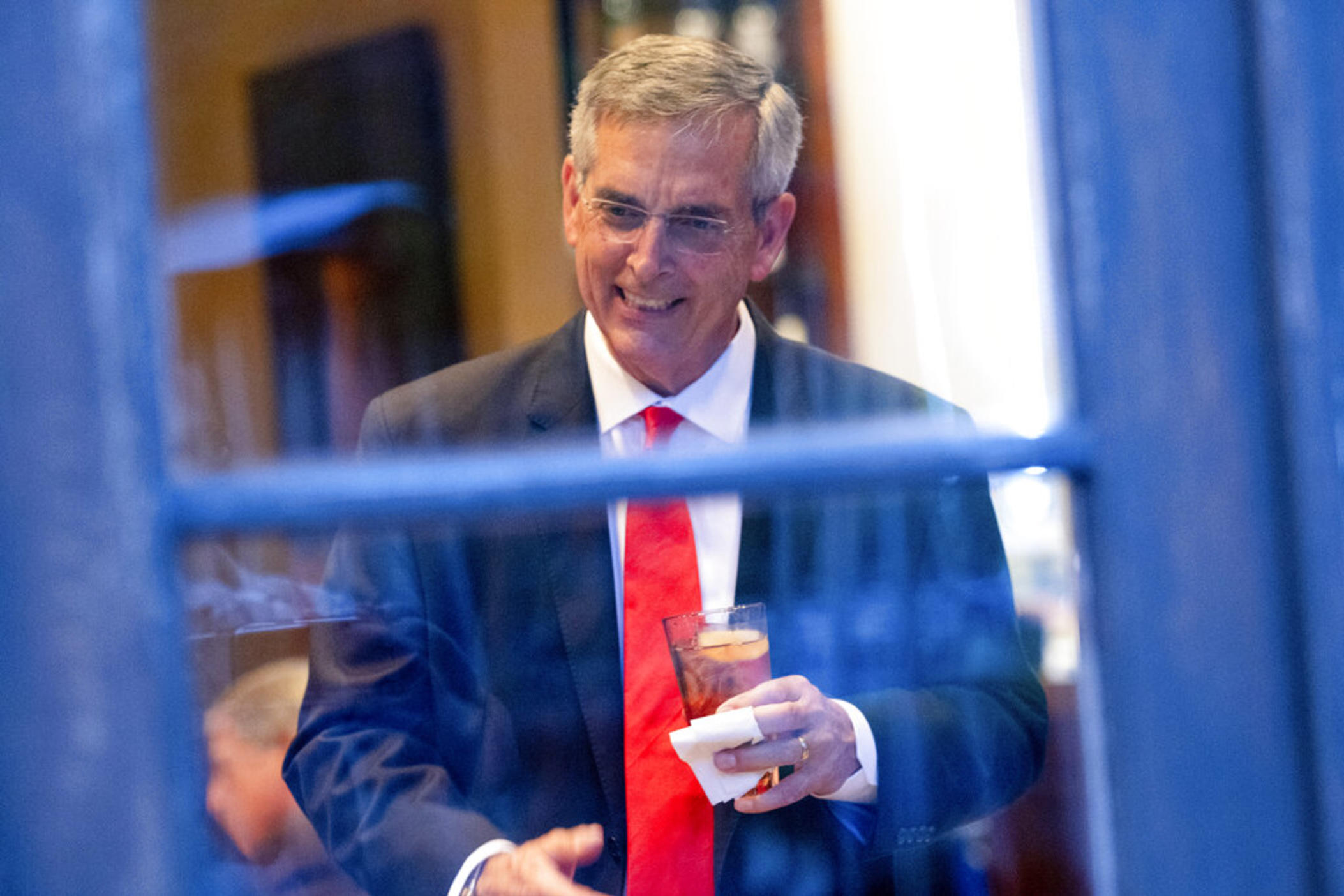 Georgia Secretary of State Brad Raffensperger talks with supporters during an election night party on May 24, 2022, at a restaurant in Peachtree Corners, Ga.