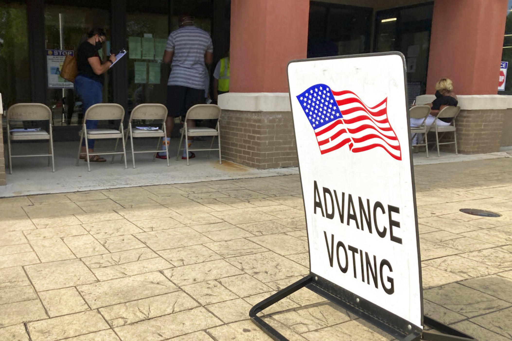 An advanced voting sign is seen, in Marietta, Ga. on May 19, 2022 during early-in person voting before Georgia's May 24, 2022 primary. Changes in Georgia state law have left less time to vote early before the June 21, 2022 runoff.