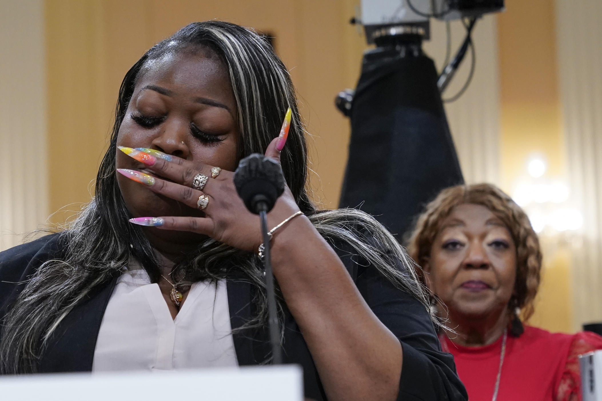 Wandrea "Shaye" Moss, a former Georgia election worker, testifies as her mother, Ruby Freeman, listens, as the House select committee investigating the Jan. 6 attack on the U.S. Capitol continues to reveal its findings of a yearlong investigation, at the Capitol in Washington, Tuesday, June 21, 2022. 