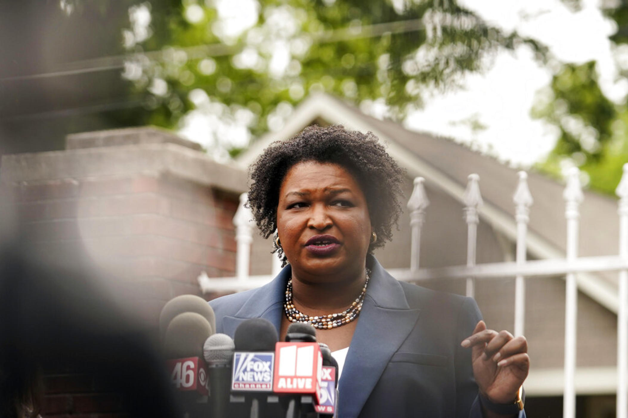 Georgia Democratic gubernatorial candidate Stacey Abrams talks to the media during Georgia's primary election on Tuesday, May 24, 2022, in Atlanta.