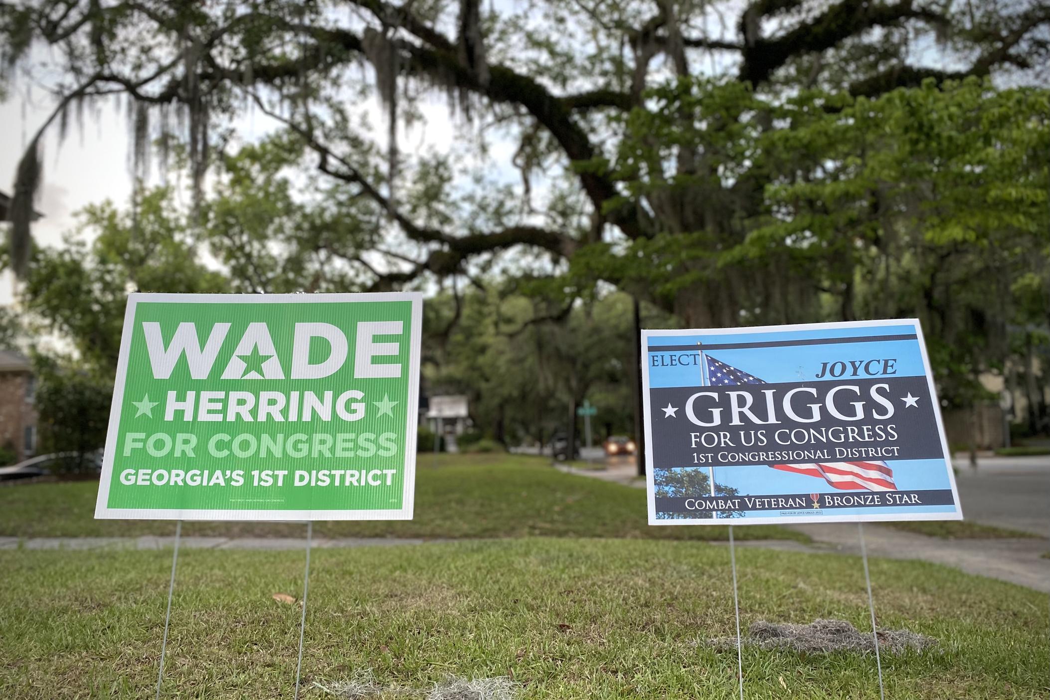 Yard signs for Wade Herring and Joyce Griggs are displayed outside an apartment building in Savannah. The two Democrats are running for Georgia's 1st Congressional District, and face each other in a primary runoff election on Tuesday, June 21.