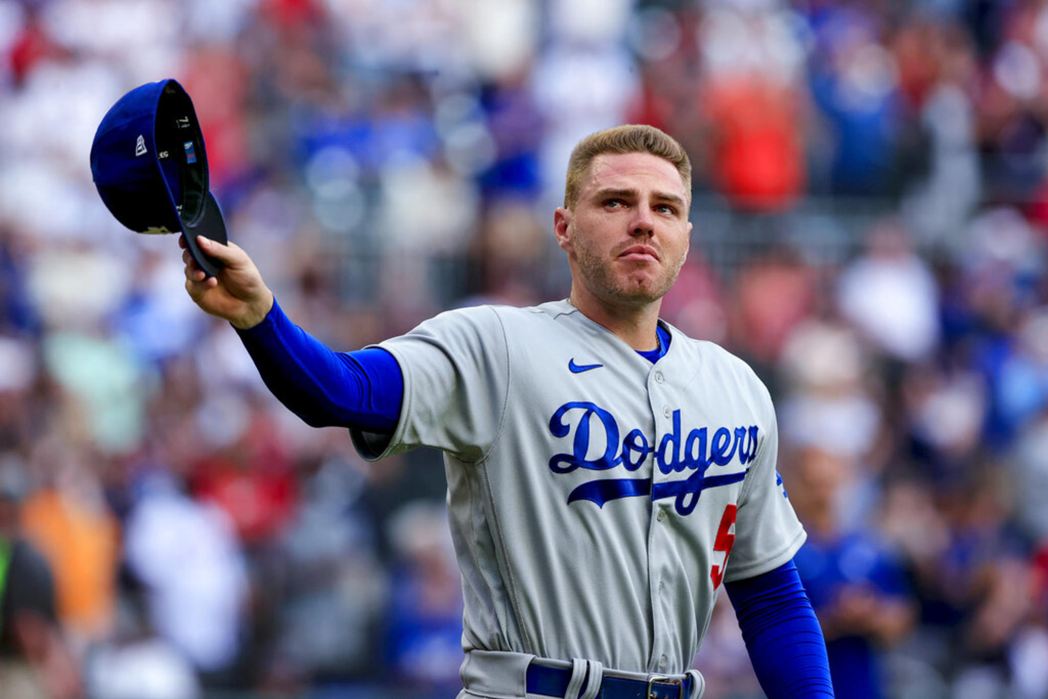 Los Angeles Dodgers first baseman Freddie Freeman walks to the field for the presentation of his World Series championship ring, before the team's baseball game against the Atlanta Braves on Friday, June 24, 2022 in Atlanta. 