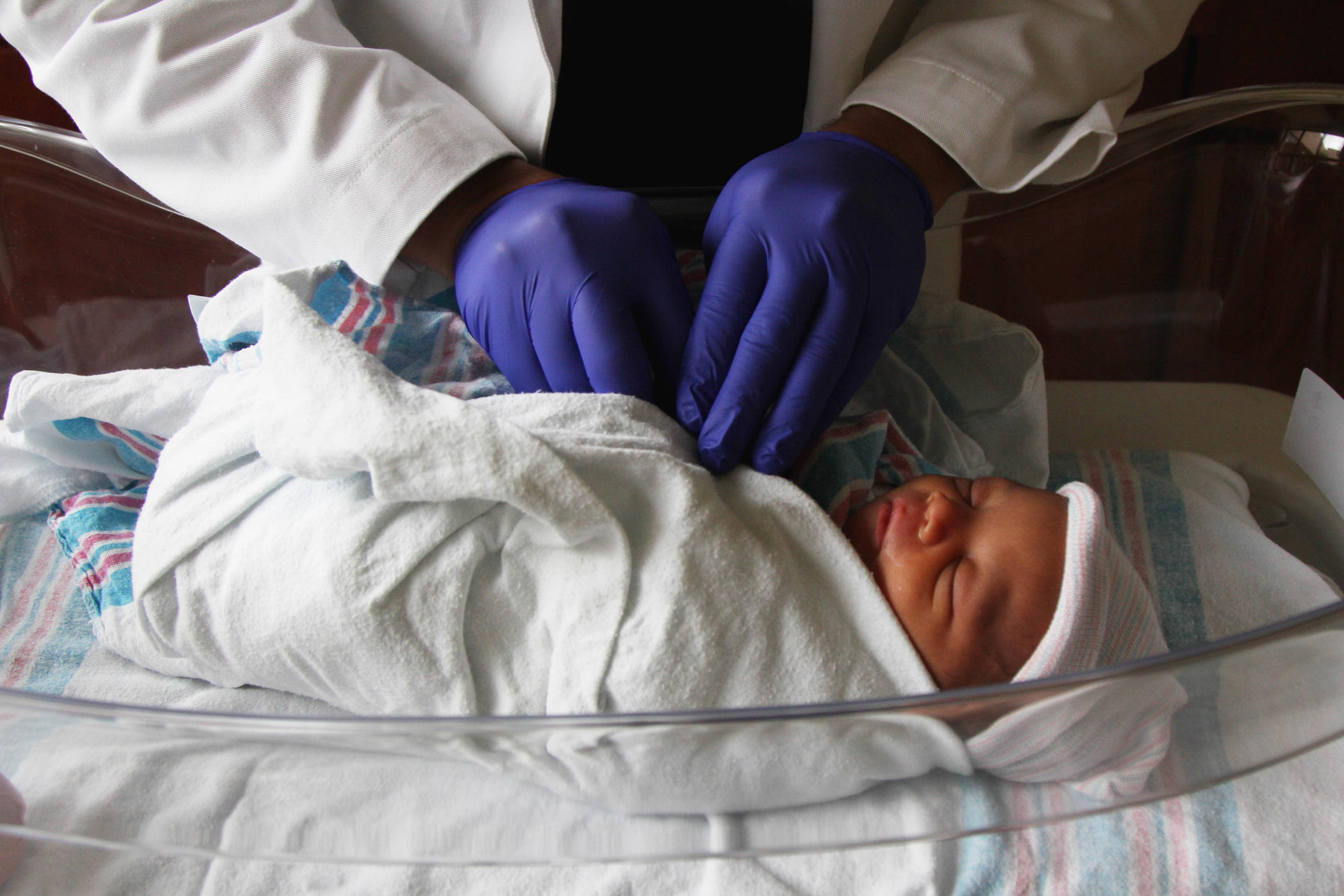 Second-year family medicine resident Rickey Patel performs a hearing exam on a newborn at Colquitt Regional Medical Center in Moultrie, GA, on June 25, 2022. Doctors in unopposed residency programs, meaning they're the only residents at the hospital, often have more opportunities to work closely with patients and attending physicians.