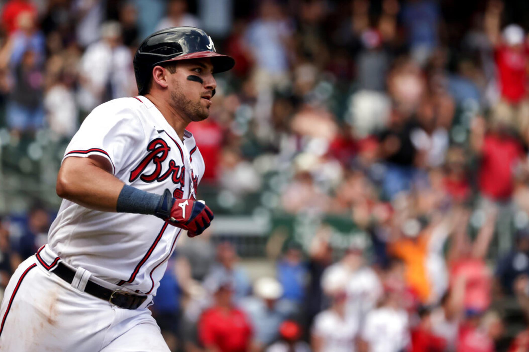 Atlanta Braves' Austin Riley runs to first on a game winning RBI during the ninth inning of a baseball game against the Arizona Diamondbacks, Sunday, July 31, 2022, in Atlanta.