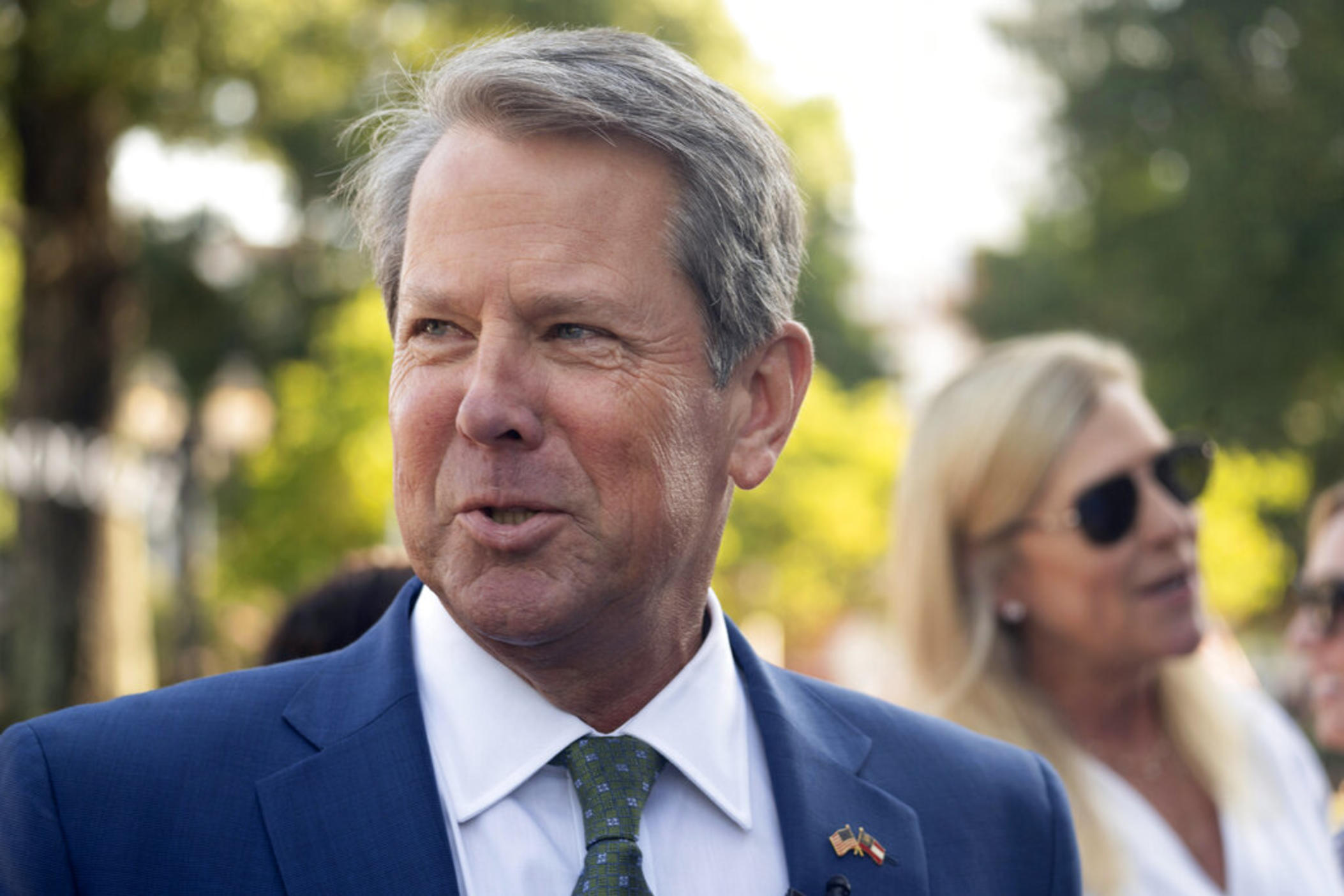 Georgia Gov. Brian Kemp speaks at The Neighborhood Lot on Friday, July 29, 2022, in McDonough, Ga. On Monday, Aug. 15, 2022, Kemp announced he would use federal COVID-19 relief money to make $350 payments to more than 3 million Georgians who benefit from Medicaid, subsidized child health insurance, food stamps or cash welfare.