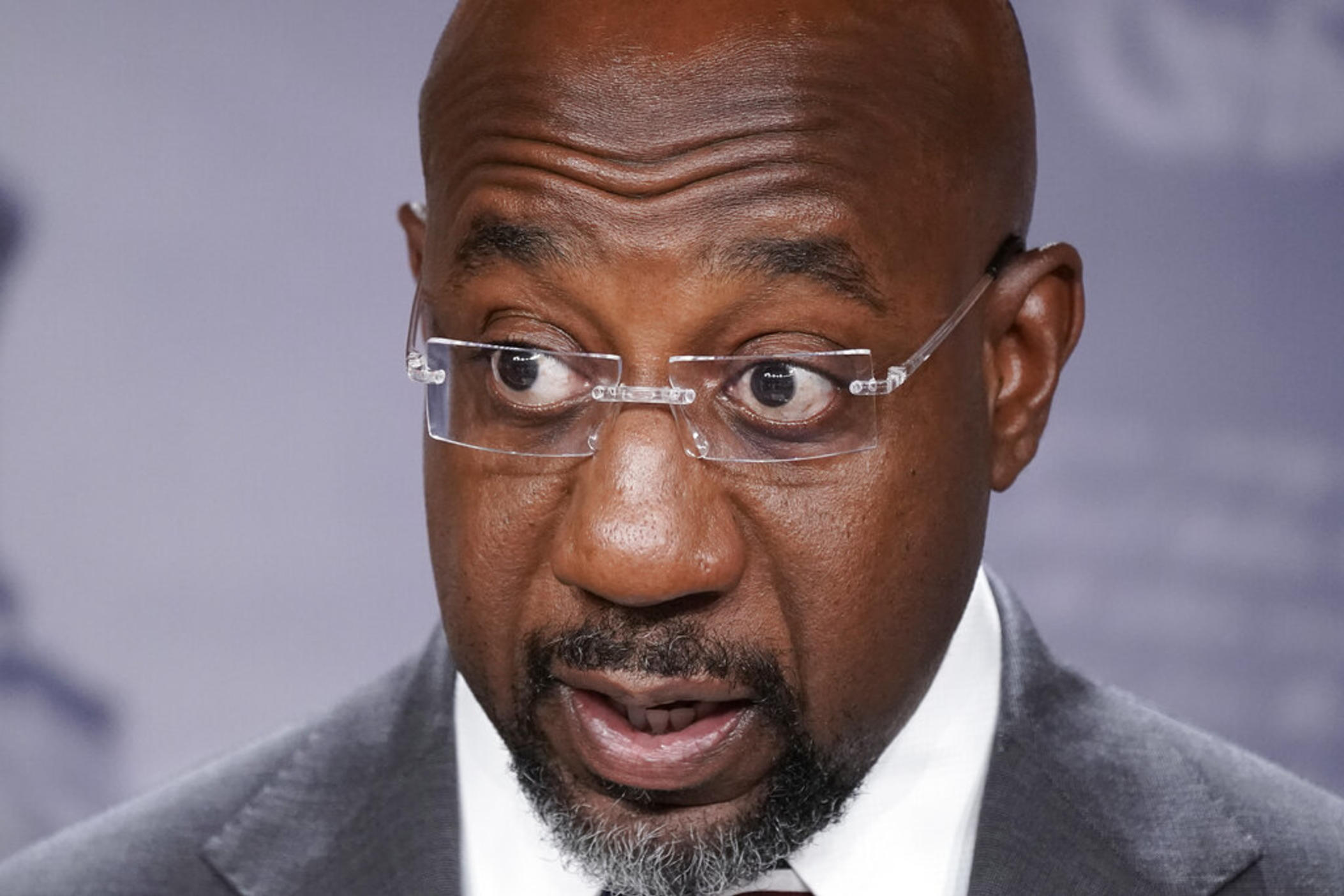 Sen. Raphael Warnock, D-Ga., joins Senate Majority Leader Chuck Schumer, D-N.Y., to speak to reporters after the Senate advanced a $280 billion bill designed to boost the U.S. semiconductor industry and to accelerate high tech research that backers say will be critical to the economy in future decades, at the Capitol in Washington, July 26, 2022. Warnock is running for his first full Senate term, pitching himself as a lawmaker willing to do whatever it takes to help his state.