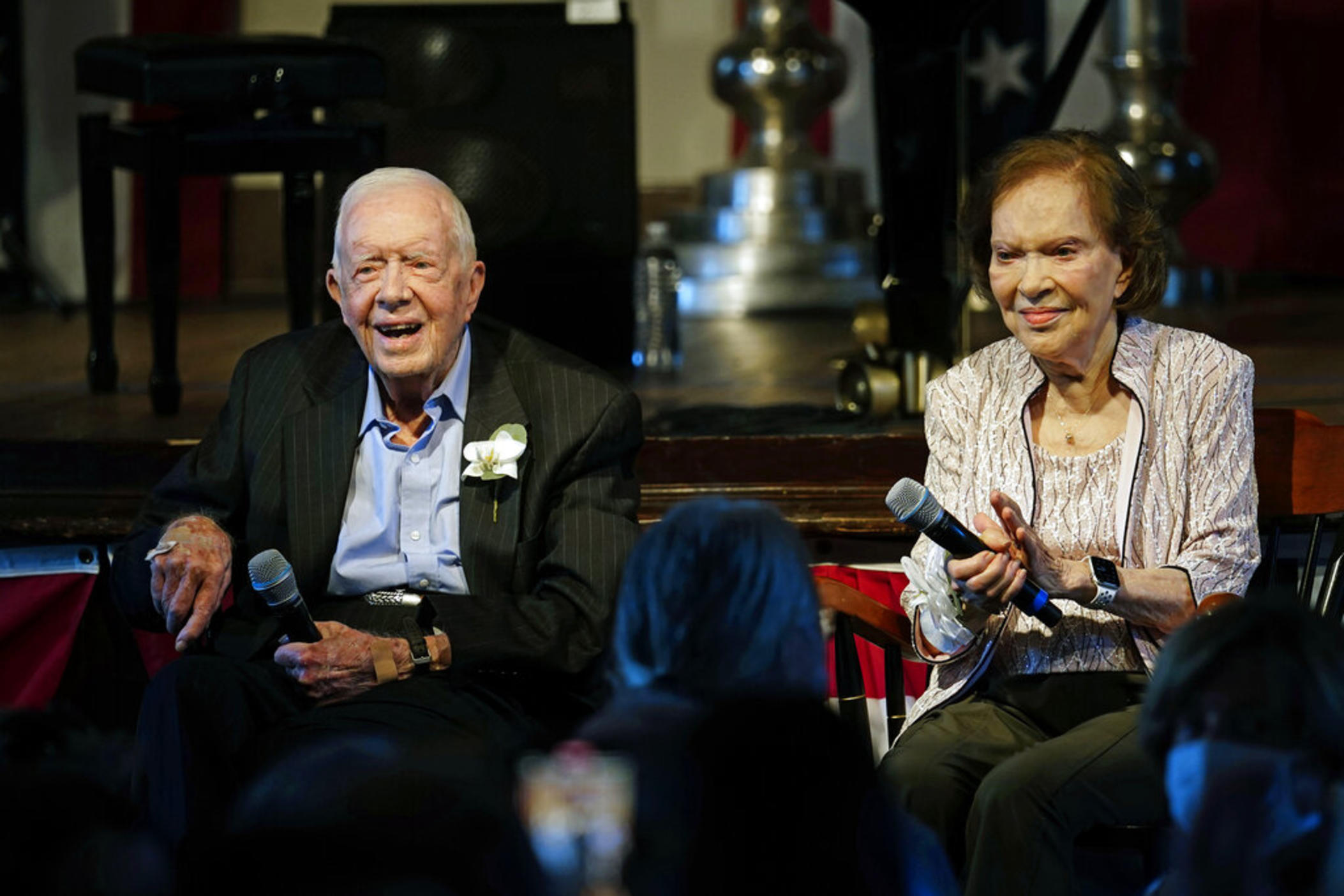 Former U.S. President Jimmy Carter and his wife, former first lady Rosalynn Carter, sit together during a reception to celebrate their 75th wedding anniversary on Saturday, July 10, 2021, in Plains, Ga. On Thursday, Aug. 18, 2022, Carter, the second-oldest U.S. first lady ever, turns 95. 