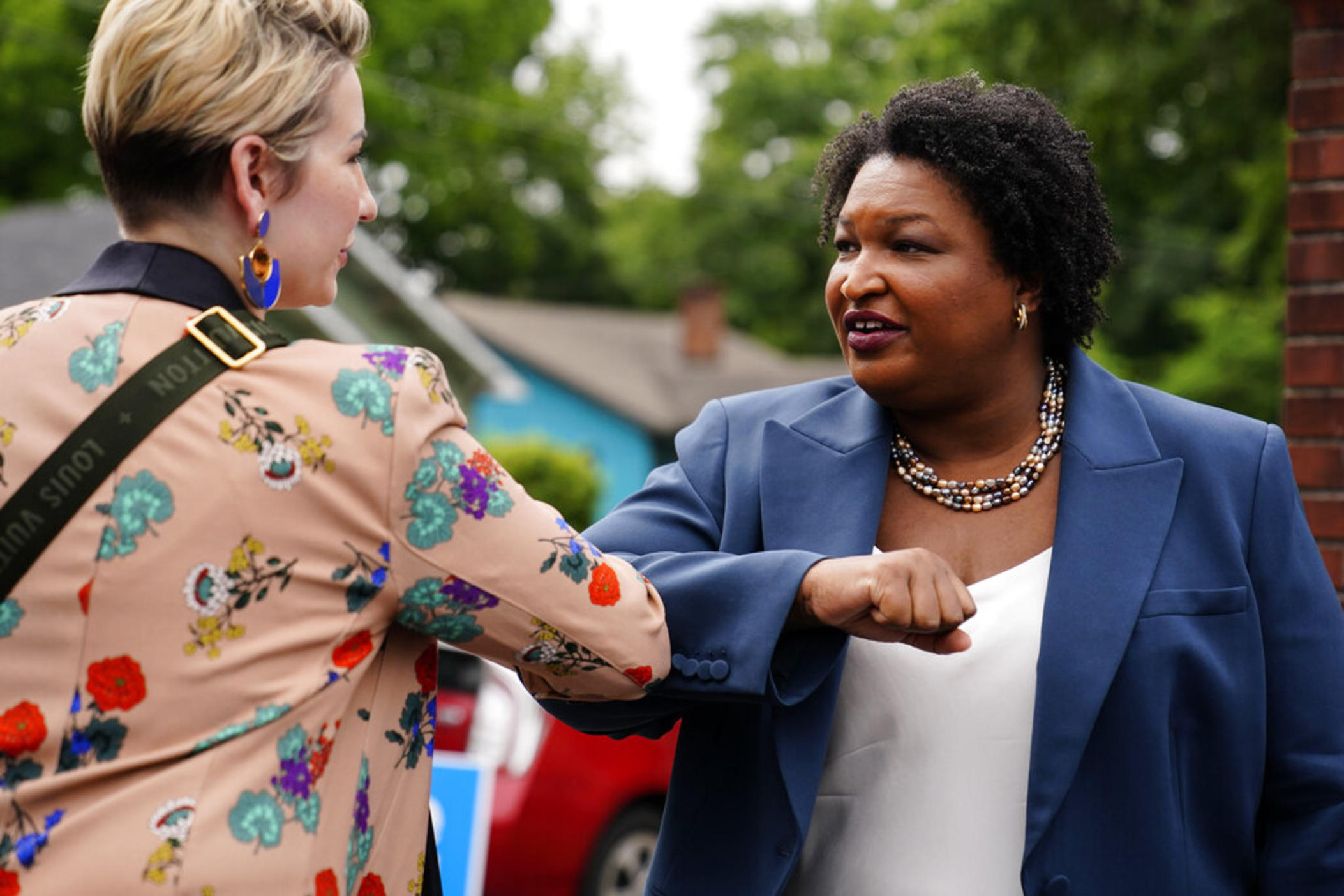 Georgia Democratic gubernatorial candidate Stacey Abrams greets a supporter May 24, 2022, in Atlanta. Georgia Gov. Abrams is launching an intensive effort to get out the vote by urging potential supporters to cast in-person ballots the first week of early voting as she tries to navigate the state’s new election laws.