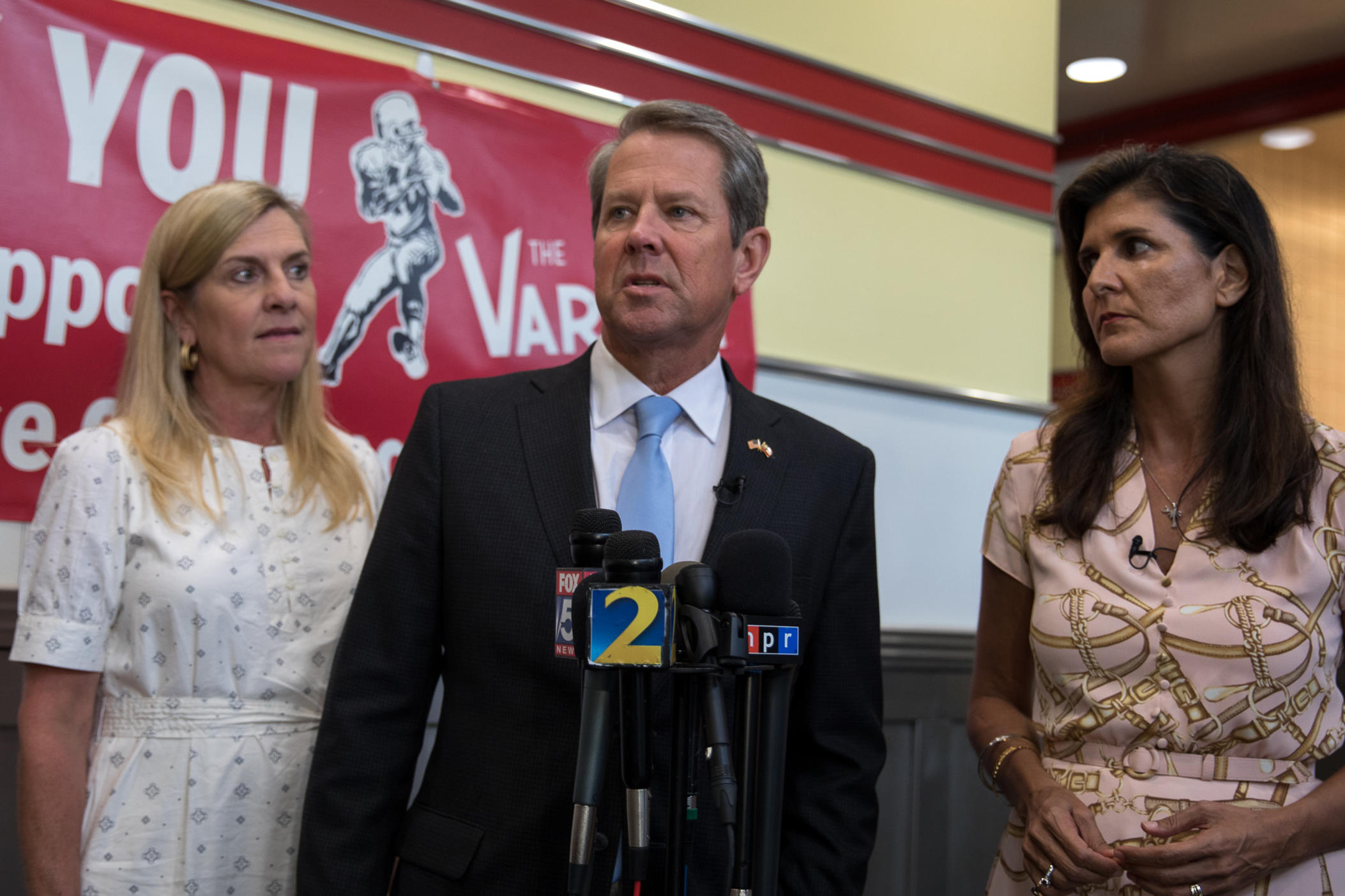 Gov. Brian Kemp campaigns with Nikki Haley (right) and his wife Marty Kemp